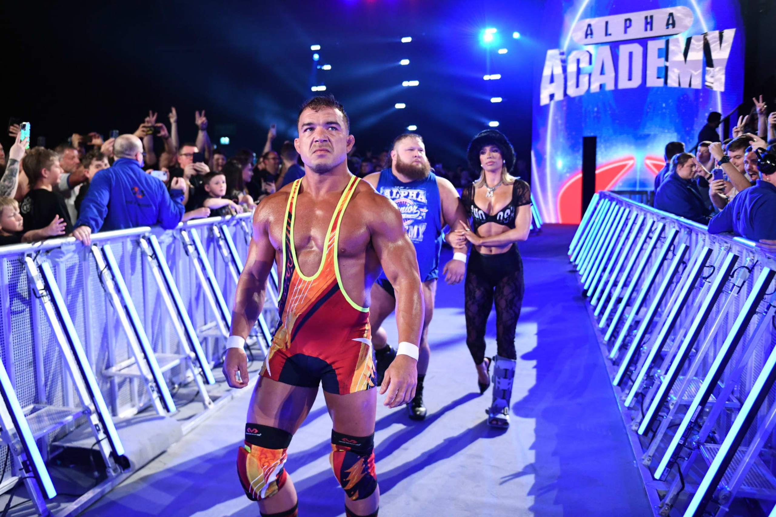GLASGOW, SCOTLAND - JUNE 15: Chad Gable, Otis and Maxine Duper of the Alpha Academy make their entrance for Gable's WWE Intercontinental Title match against Sami Zayn (not pictured) during WWE's Clash at the Castle, Premium Live Event at The OVO Hydro on June 15, 2024 in Glasgow, Scotland.  (Photo by WWE/Getty Images)