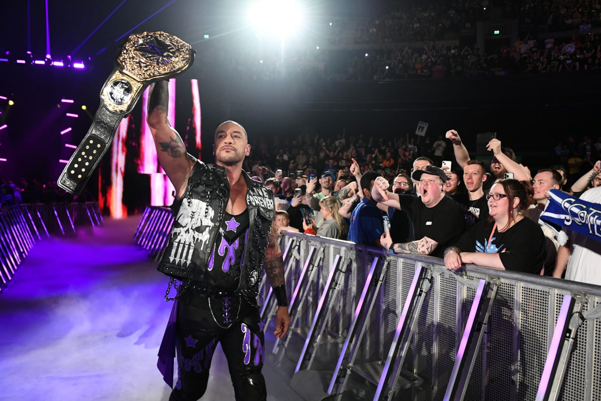 GLASGOW, SCOTLAND - JUNE 15: WWE Heavyweight Champion Damian Priest makes his entrance during WWE's Clash at the Castle, Premium Live Event at The OVO Hydro on June 15, 2024 in Glasgow, Scotland.  (Photo by WWE/Getty Images)