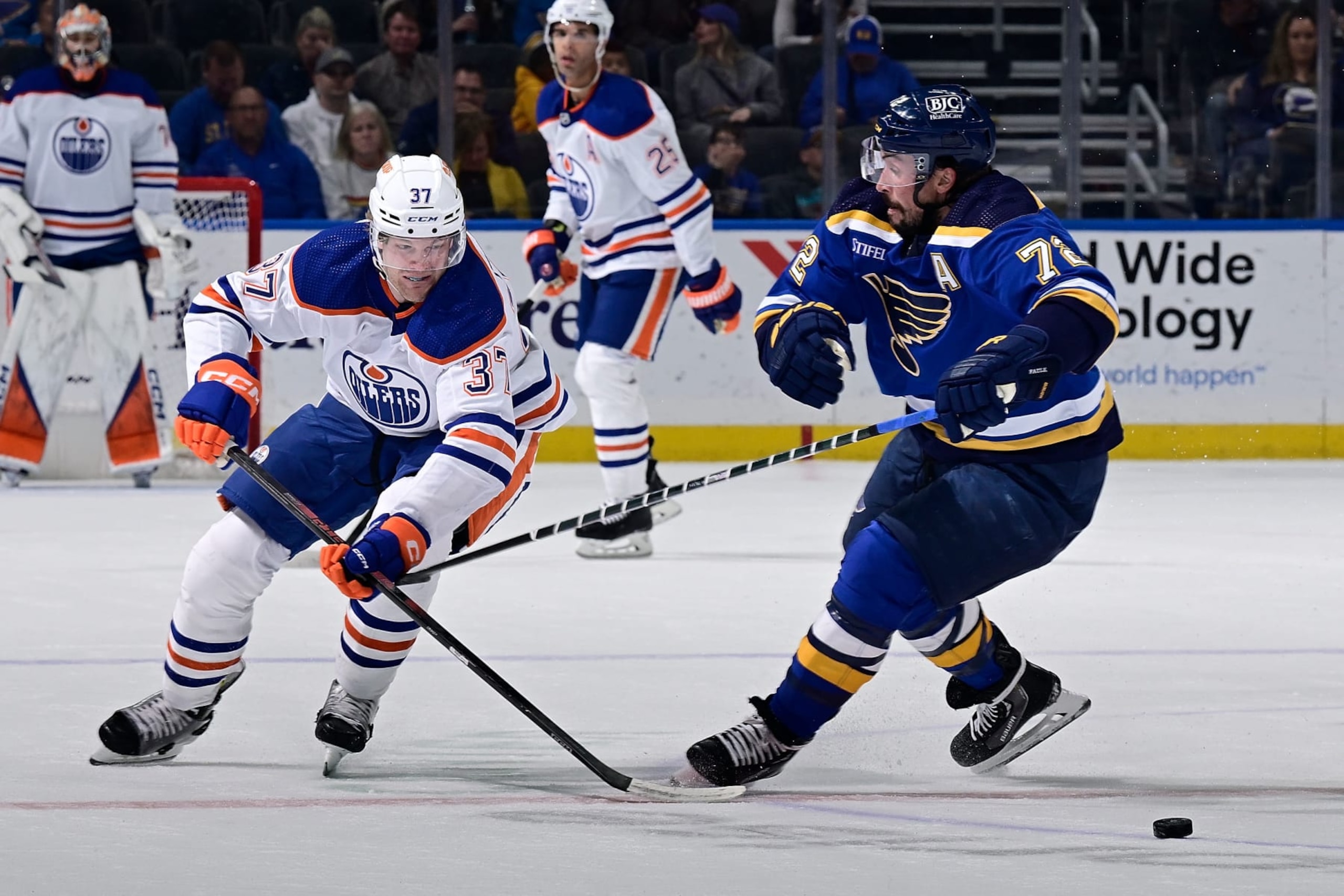 ST. LOUIS, MO - APRIL 1: Justin Faulk #72 of the St. Louis Blues defends against Warren Foegele #37 of the Edmonton Oilers on April 1, 2024 at the Enterprise Center in St. Louis, Missouri. (Photo by Scott Rovak/NHLI via Getty Images) ST. LOUIS, MO - APRIL 1: Justin Faulk #72 of the St. Louis Blues defends against Warren Foegele #37 of the Edmonton Oilers on April 1, 2024 at the Enterprise Center in St. Louis, Missouri. (Photo by Scott Rovak/NHLI via Getty Images)
