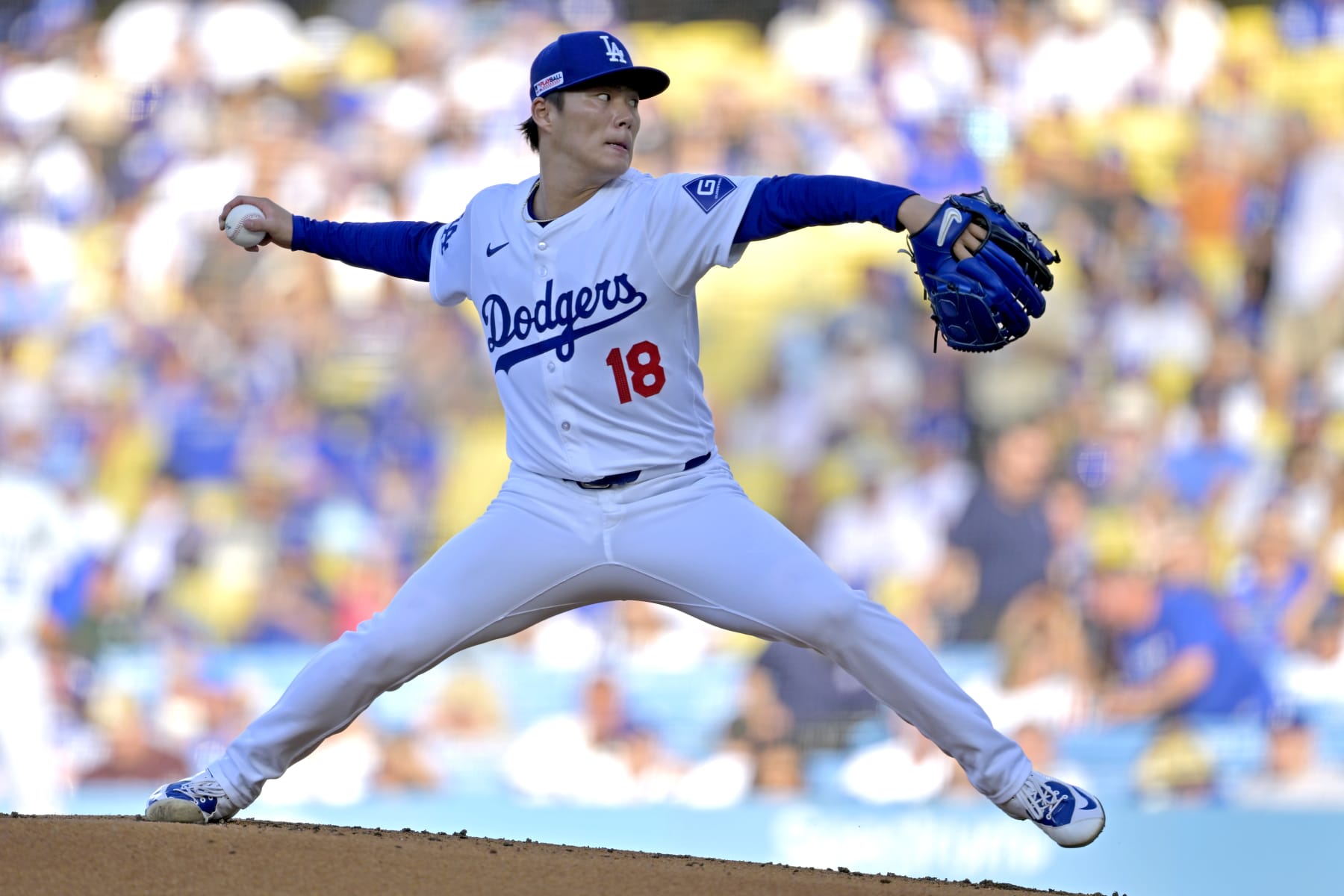 LOS ANGELES, CALIFORNIA - JUNE 15: Yoshinobu Yamamoto #18 of the Los Angeles Dodgers delivers to the plate in the second inning against the Kansas City Royals at Dodger Stadium on June 15, 2024 in Los Angeles, California. (Photo by Jayne Kamin-Oncea/Getty Images)