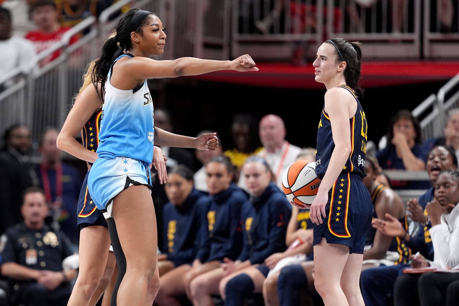 INDIANAPOLIS, INDIANA - JUNE 16: Angel Reese #5 of the Chicago Sky reacts after fouling Caitlin Clark #22 of the Indiana Fever during the second half at Gainbridge Fieldhouse on June 16, 2024 in Indianapolis, Indiana. NOTE TO USER: User expressly acknowledges and agrees that, by downloading and or using this photograph, User is consenting to the terms and conditions of the Getty Images License Agreement. (Photo by Emilee Chinn/Getty Images)