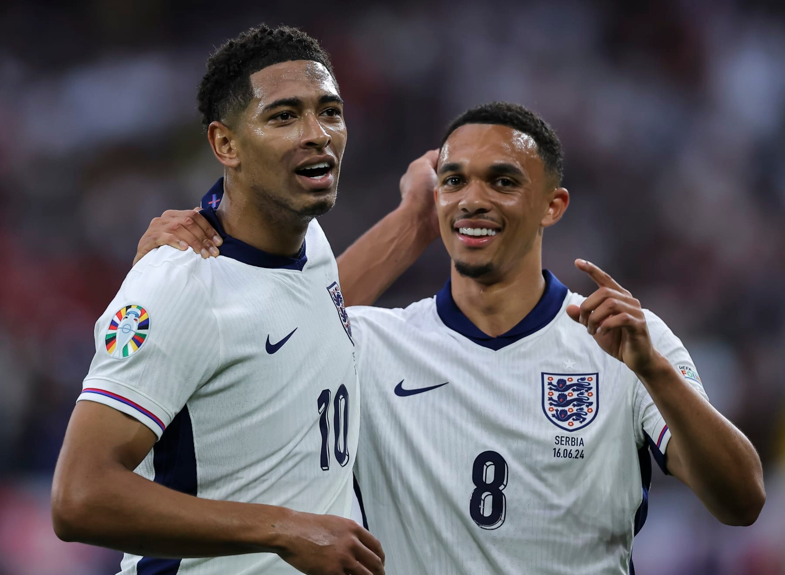 GELSENKIRCHEN, GERMANY - JUNE 16: Jude Bellingham (L) of England celebrates after scoring a goal with Trent Alexander-Arnold (R) during the UEFA EURO 2024 group stage match between Serbia and England at Arena AufSchalke on June 16, 2024 in Gelsenkirchen, Germany. (Photo by Pedja Milosavljevic/DeFodi Images)