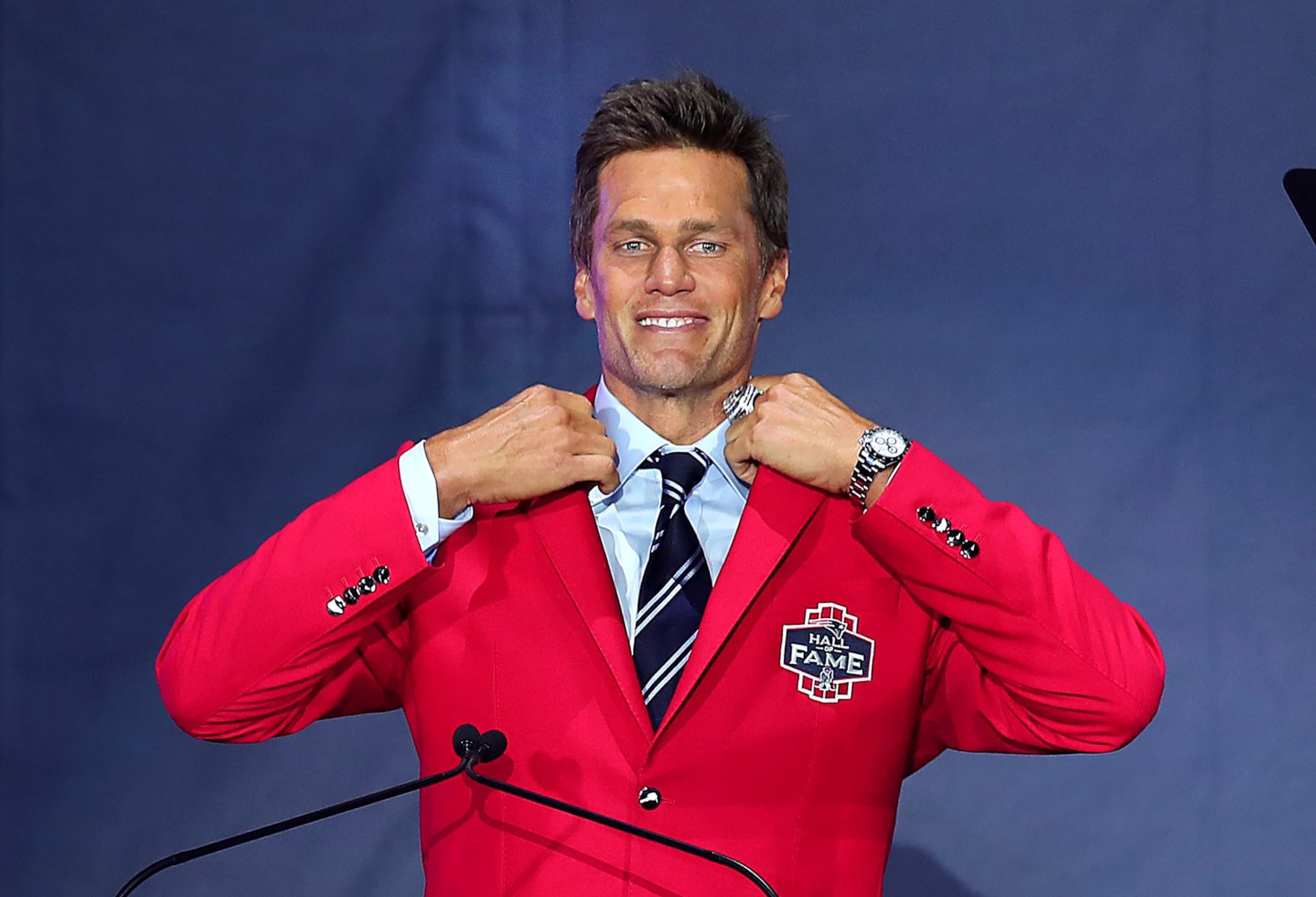 Foxborough-06/12/2024 Tom Brady, Former New England Patriots quarterback, shows off his new red jacket at Gillette Stadium after his induction into the Patriots Hall of Fame. (John Tlumacki/The Boston Globe via Getty Images)