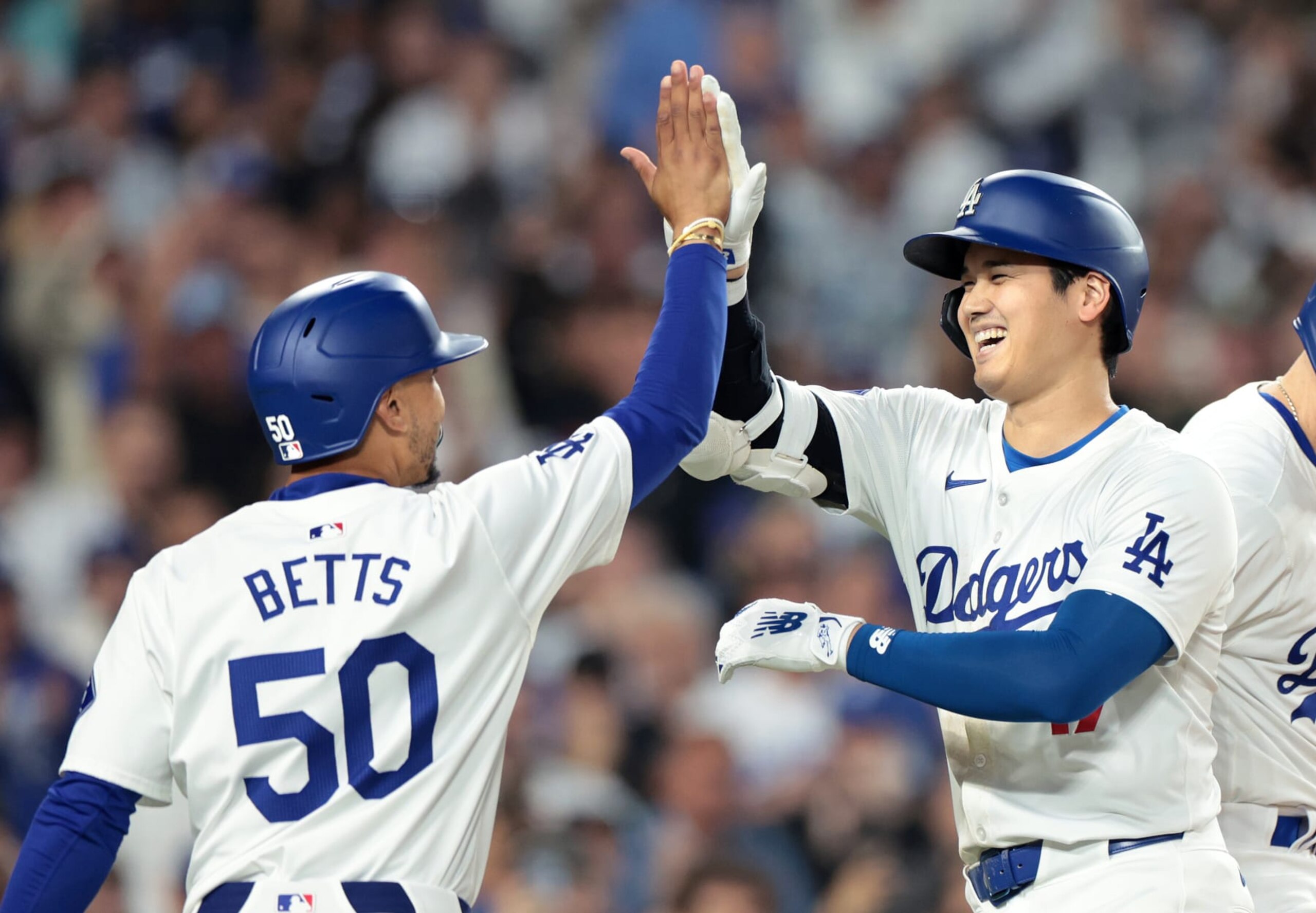 LOS ANGELES CALIFORNIA CALIFORNIA-Dodgers Shohei Ohtani celebrates his two-run home run with Mookie Betts against the Rangers in the sixth inning at Dodgers Stadium Tuesday. (Wally Skalij/Los Angeles Times via Getty Images)