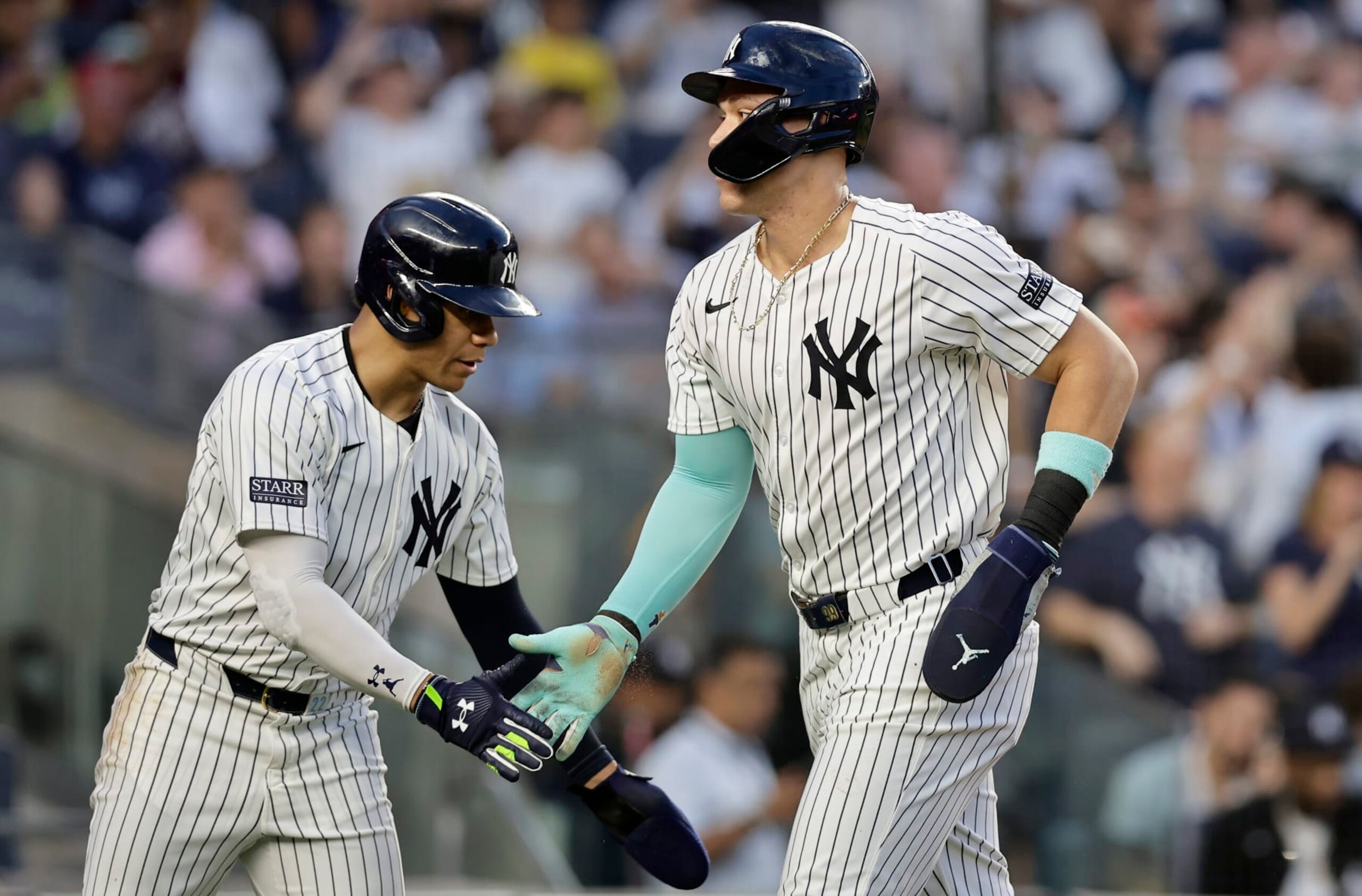 NEW YORK, NEW YORK - JUNE 06:  Aaron Judge #99 and Juan Soto #22 of the New York Yankees celebrate scoring in the third inning against the Minnesota Twins at Yankee Stadium on June 06, 2024 in New York City. (Photo by Jim McIsaac/Getty Images)