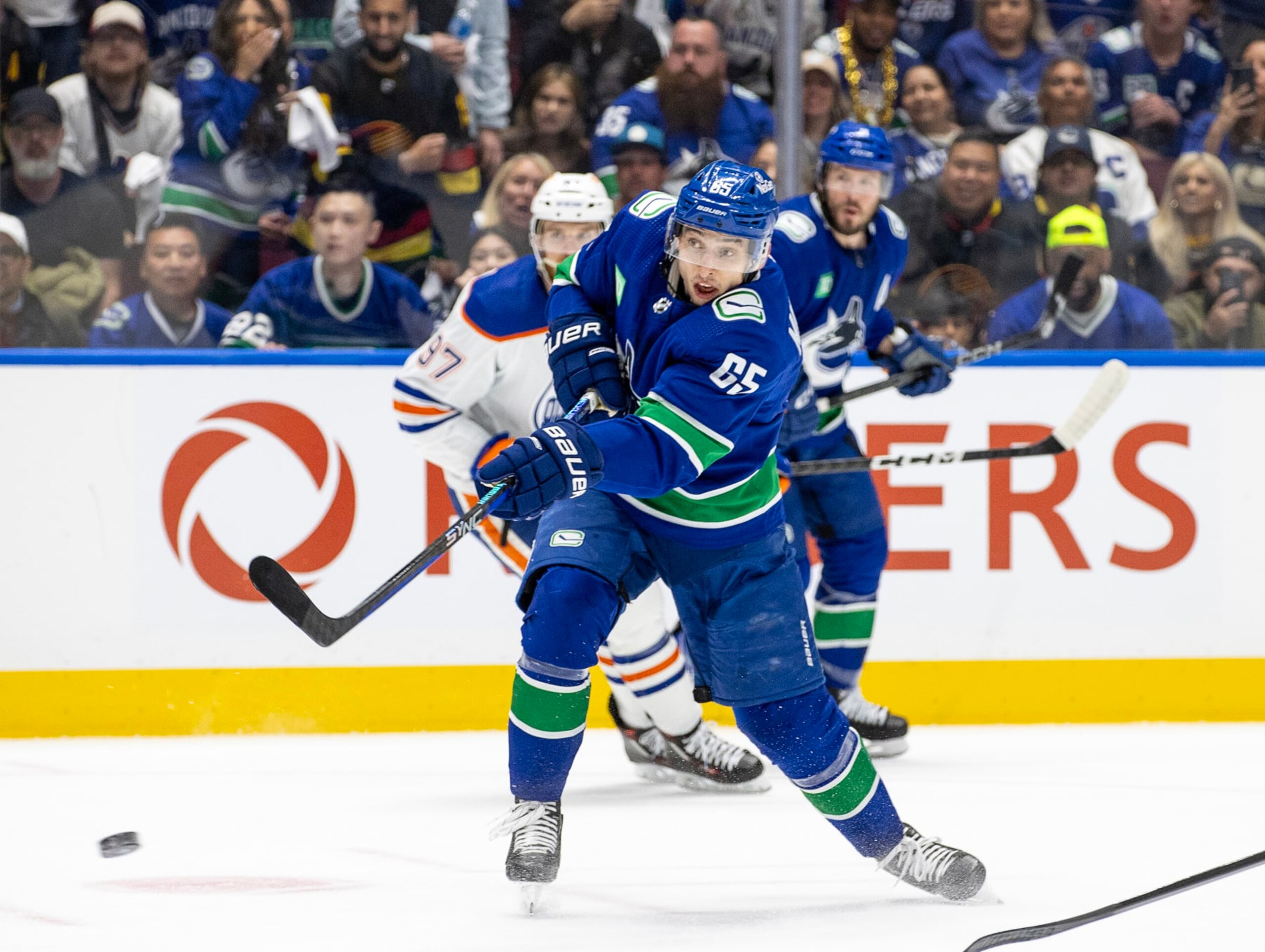 VANCOUVER, CANADA - MAY 20: Ilya Mikheyev #65 of the Vancouver Canucks hits the puck down the ice during the first period in Game Seven of the Second Round of the 2024 Stanley Cup Playoffs against the Edmonton Oilers at Rogers Arena on May 20, 2024 in Vancouver, British Columbia, Canada. (Photo by Jeff Vinnick/NHLI via Getty Images) VANCOUVER, CANADA - MAY 20: Ilya Mikheyev #65 of the Vancouver Canucks hits the puck down the ice during the first period in Game Seven of the Second Round of the 2024 Stanley Cup Playoffs against the Edmonton Oilers at Rogers Arena on May 20, 2024 in Vancouver, British Columbia, Canada. (Photo by Jeff Vinnick/NHLI via Getty Images)