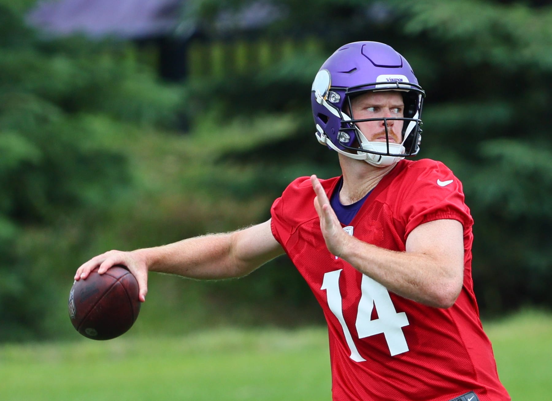 EAGAN, MINNESOTA - JUNE 04: Sam Darnold #14 of the Minnesota Vikings throws the ball during Minnesota Vikings mandatory minicamp at Twin Cities Orthopedics Performance Center on June 04, 2024 in Eagan, Minnesota.(Photo by Adam Bettcher/Getty Images)