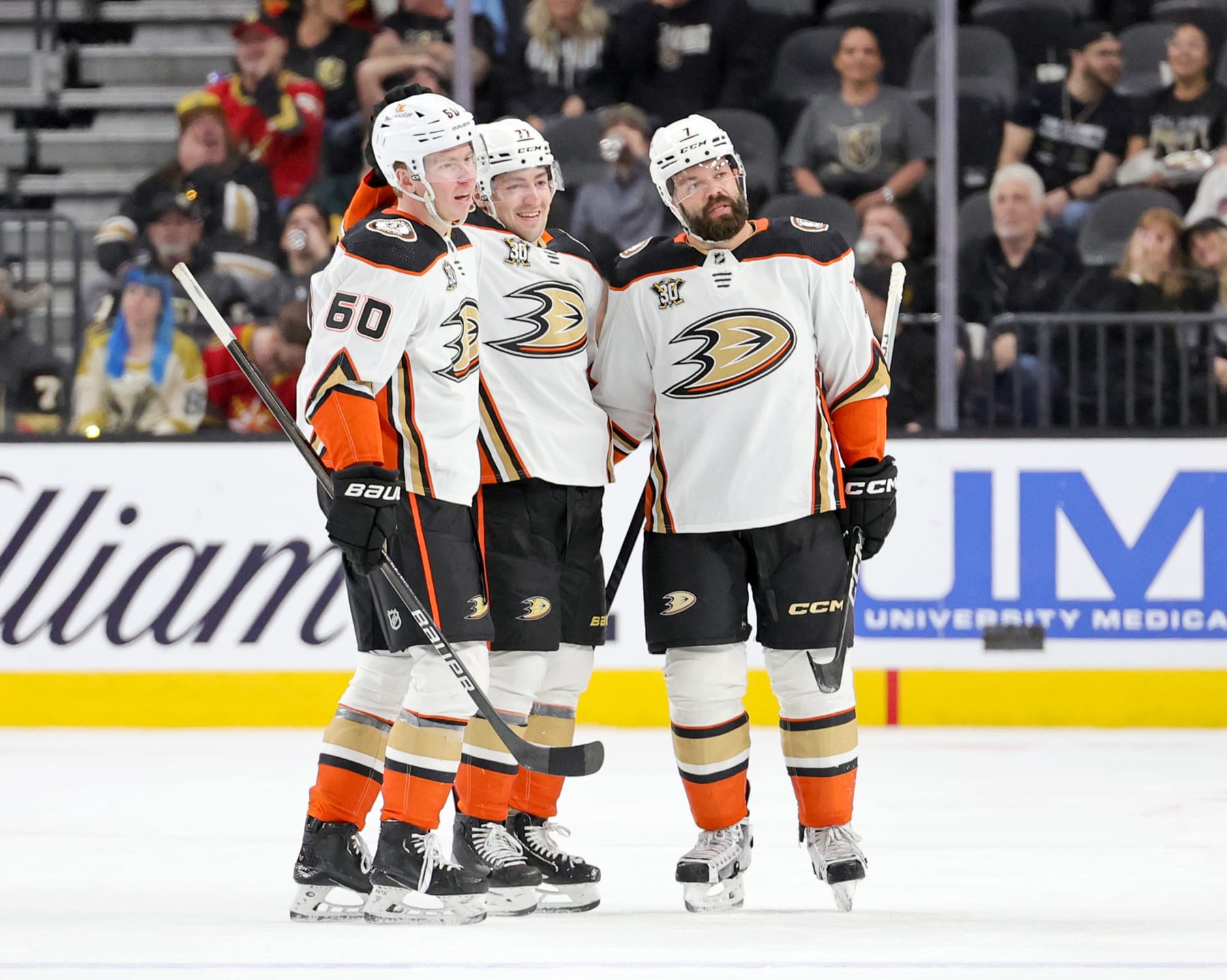 LAS VEGAS, NEVADA - APRIL 18: Jackson LaCombe #60, Frank Vatrano #77 and Radko Gudas #7 of the Anaheim Ducks celebrate after Vatrano scored a short-handed empty-net goal, the second of his two third-period goals, and his third goal of the game, against the Vegas Golden Knights during their game at T-Mobile Arena on April 18, 2024 in Las Vegas, Nevada. The Ducks defeated the Golden Knights 4-1. (Photo by Ethan Miller/Getty Images)