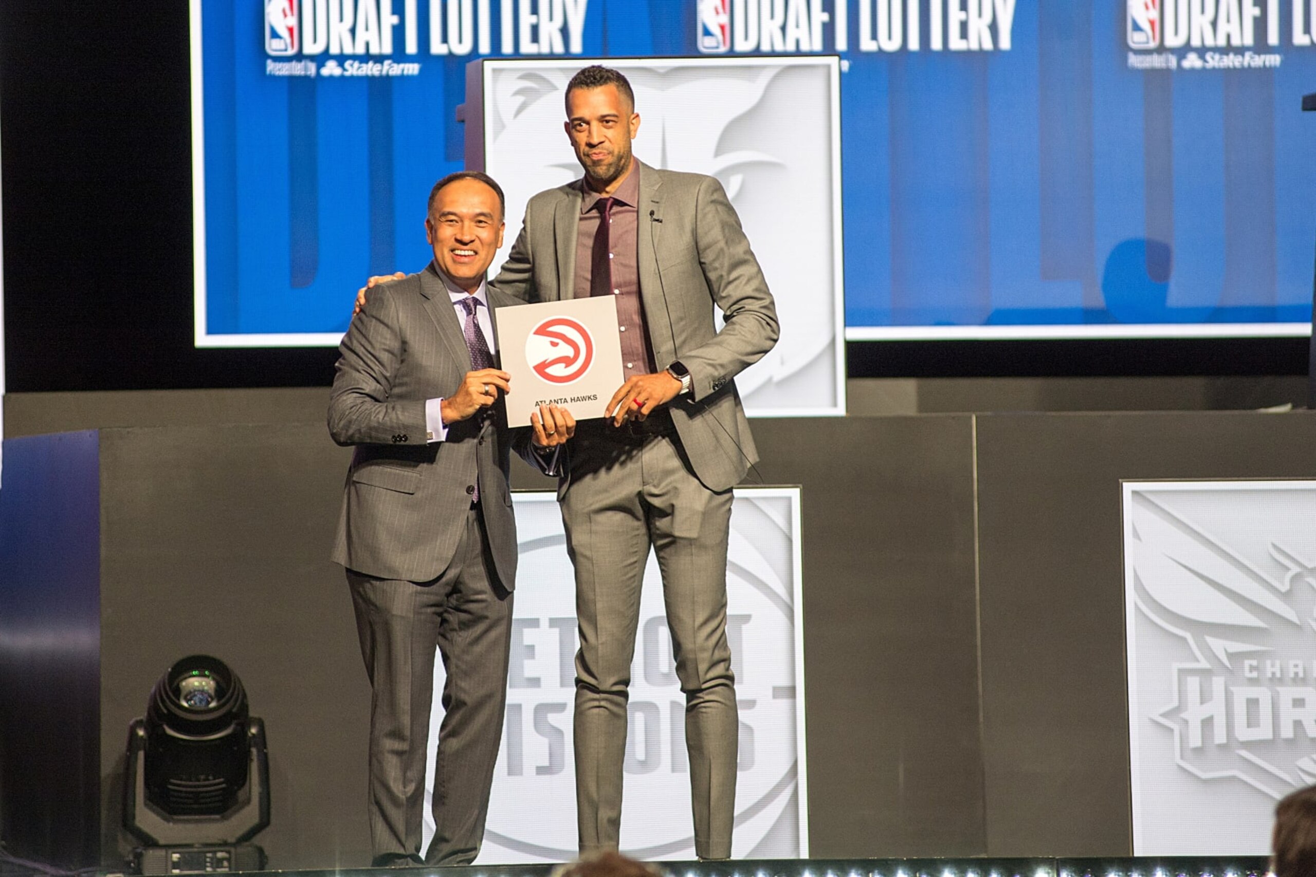 CHICAGO, UNITED STATES - MAY 12: Atlanta Hawks general manager Landry Fields (R) poses for photos after NBA Deputy Commissioner Mark Tatum (L) announced that the Hawks had won the first pick in the NBA draft, during the draft lottery in Chicago, United States on May 12, 2024. The Atlanta Hawks won the NBA draft lottery on Sunday, landing the No. 1 pick and a potential cornerstone player in a year where there's no clear-cut choice. (Photo by Jacek Boczarski/Anadolu via Getty Images)