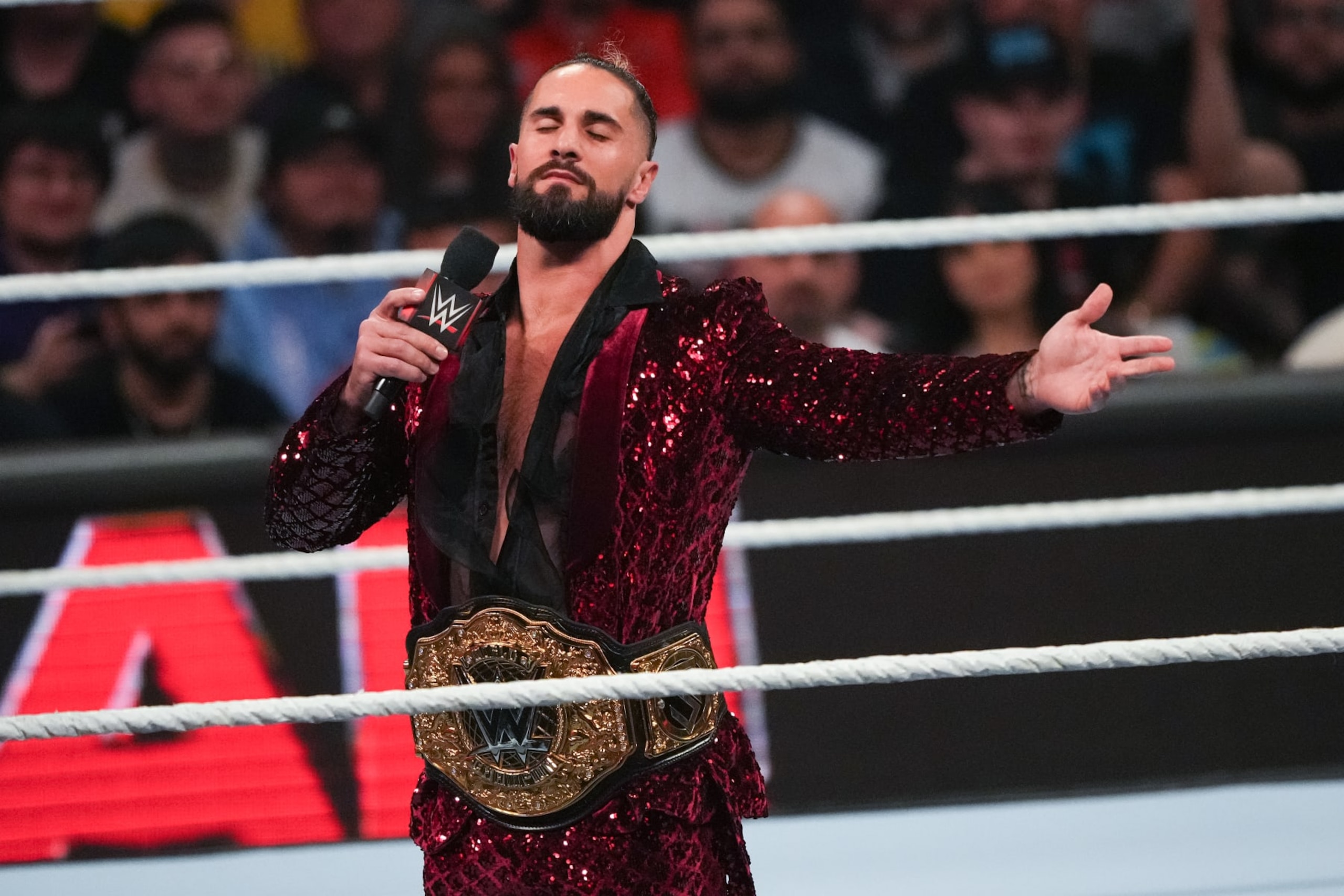HOUSTON, TEXAS - MARCH 11: Seth Rollins gestures to the crowd during WWE Monday Night RAW at Toyota Center on March 11, 2024 in Houston, Texas. (Photo by Alex Bierens de Haan/Getty Images)