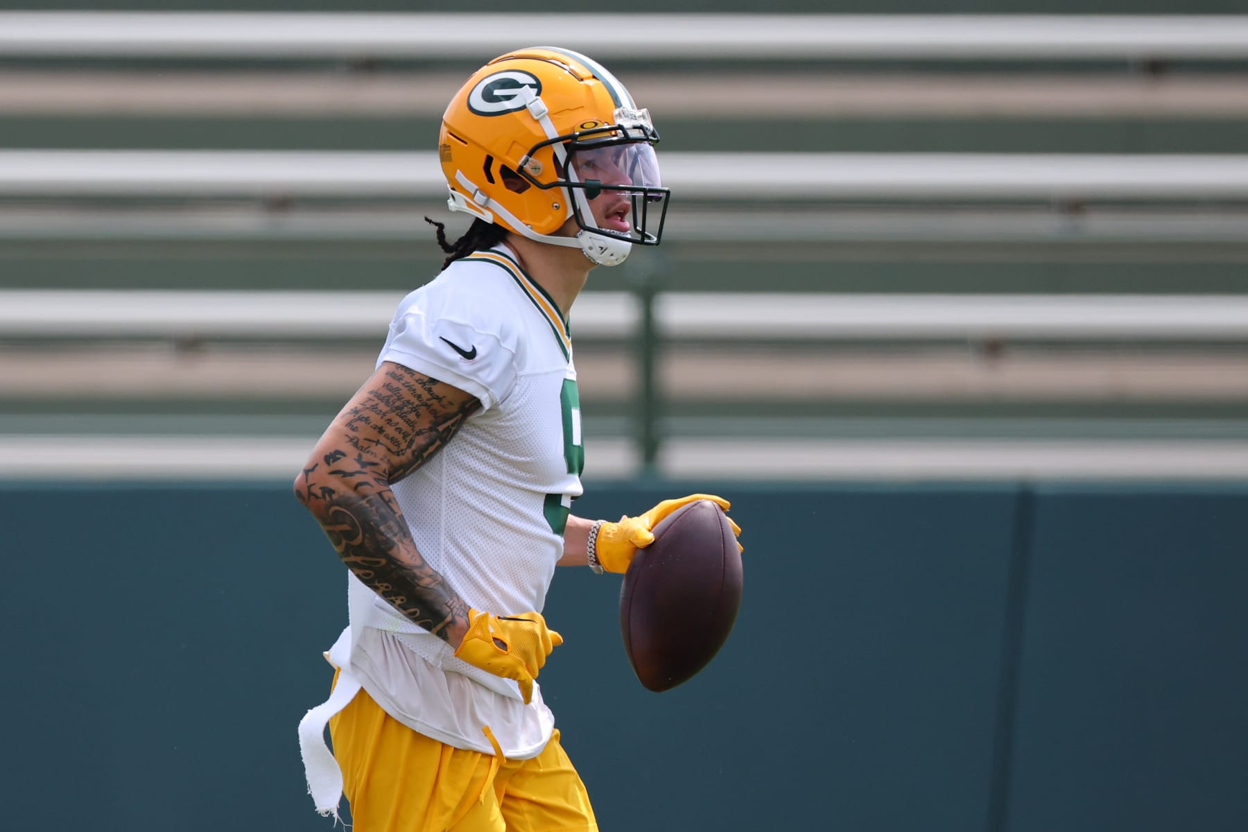 GREEN BAY, WISCONSIN - JUNE 04: Christian Watson #9 of the Green Bay Packers participates in drills during the Green Bay Packers Minicamp at Ray Nitschke Field on June 04, 2024 in Green Bay, Wisconsin.  (Photo by Stacy Revere/Getty Images)
