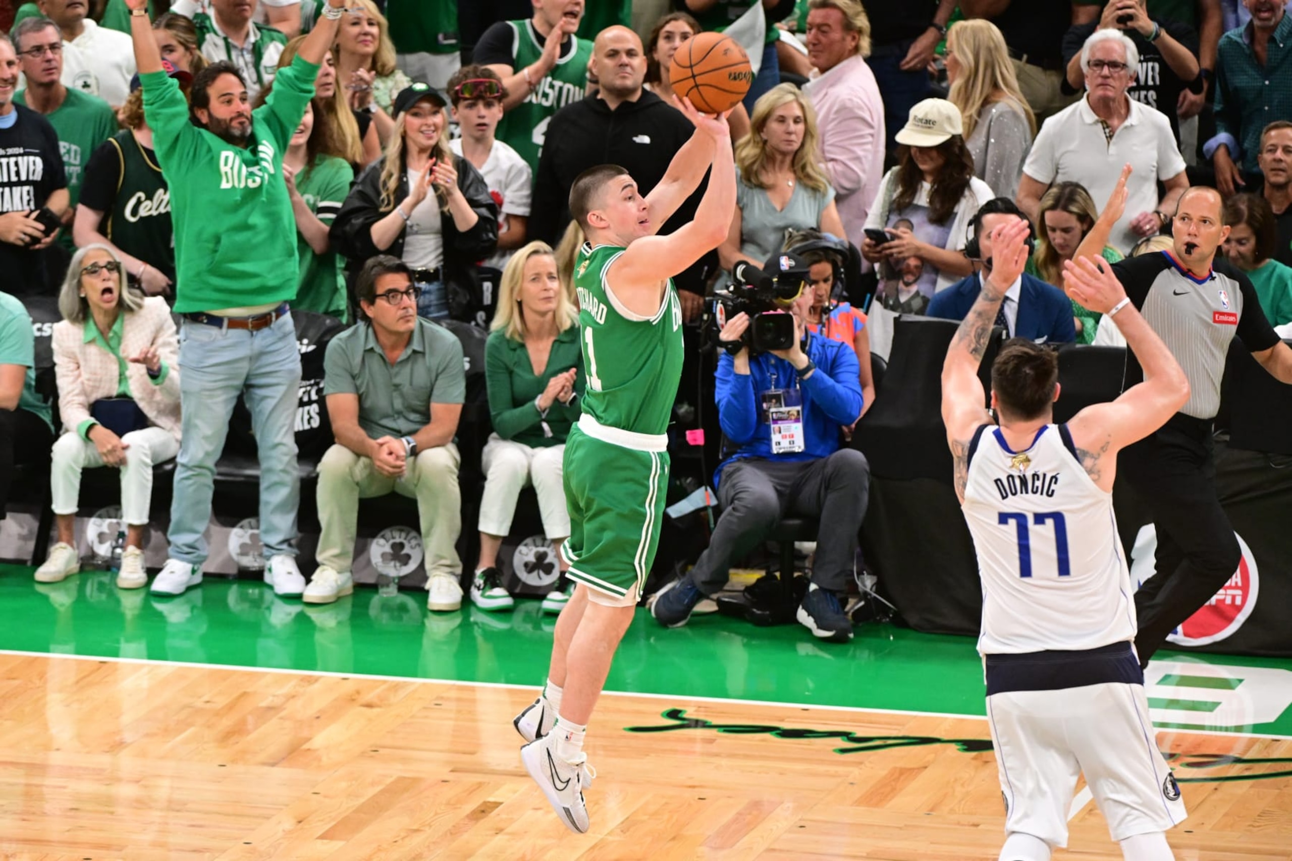 BOSTON, MA - JUNE 17: Payton Pritchard #11 of the Boston Celtics makes a buzzer beater during the game against the Dallas Mavericks during Game Five of the 2024 NBA Finals on June 17, 2024 at the TD Garden in Boston, Massachusetts. NOTE TO USER: User expressly acknowledges and agrees that, by downloading and or using this photograph, User is consenting to the terms and conditions of the Getty Images License Agreement. Mandatory Copyright Notice: Copyright 2024 NBAE  (Photo by Adam Hagy/NBAE via Getty Images)