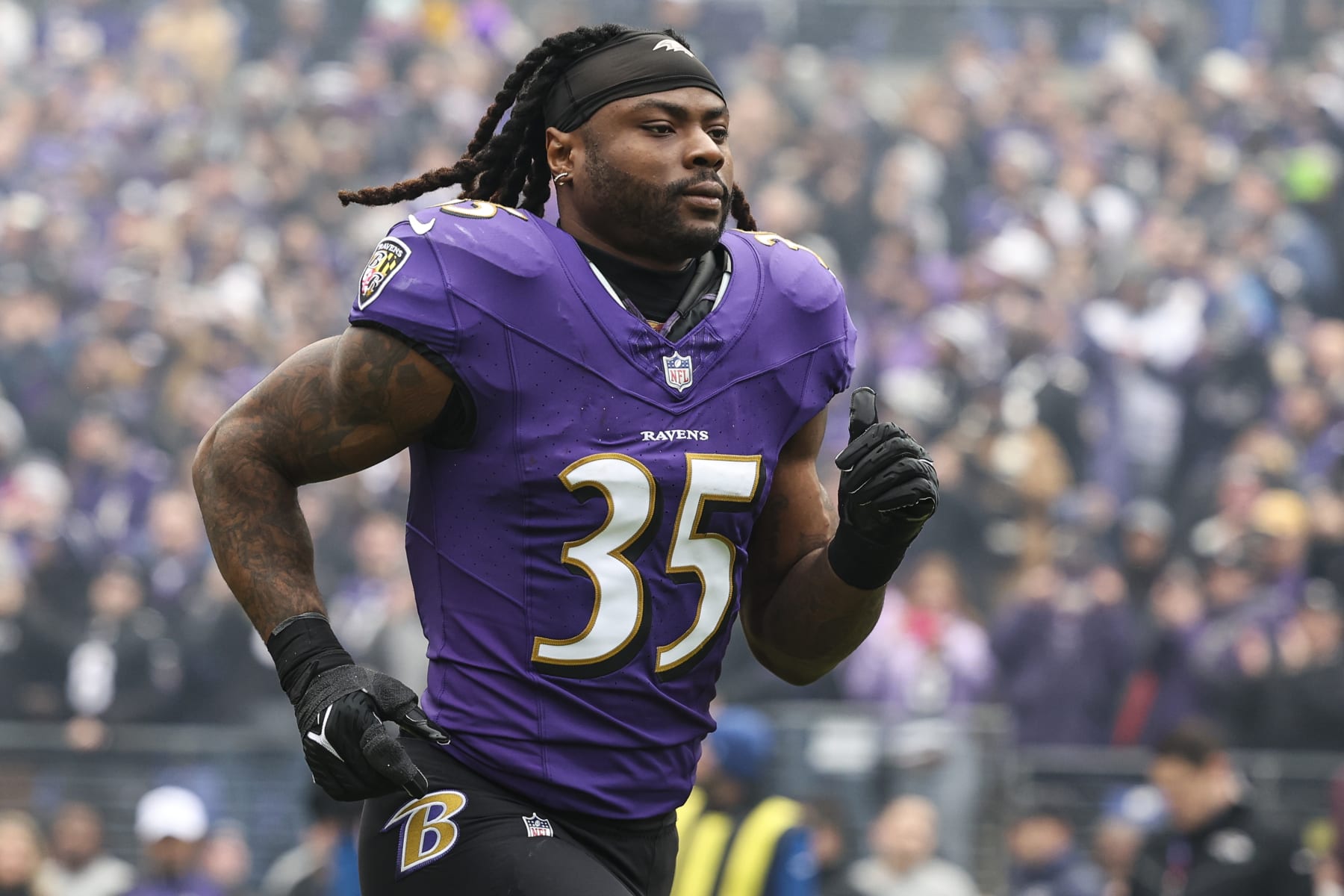 BALTIMORE, MD - JANUARY 28: Gus Edwards #35 of the Baltimore Ravens runs out of the tunnel prior to the AFC Championship NFL football game against the Kansas City Chiefs at M&T Bank Stadium on January 28, 2024 in Baltimore, Maryland. (Photo by Perry Knotts/Getty Images)