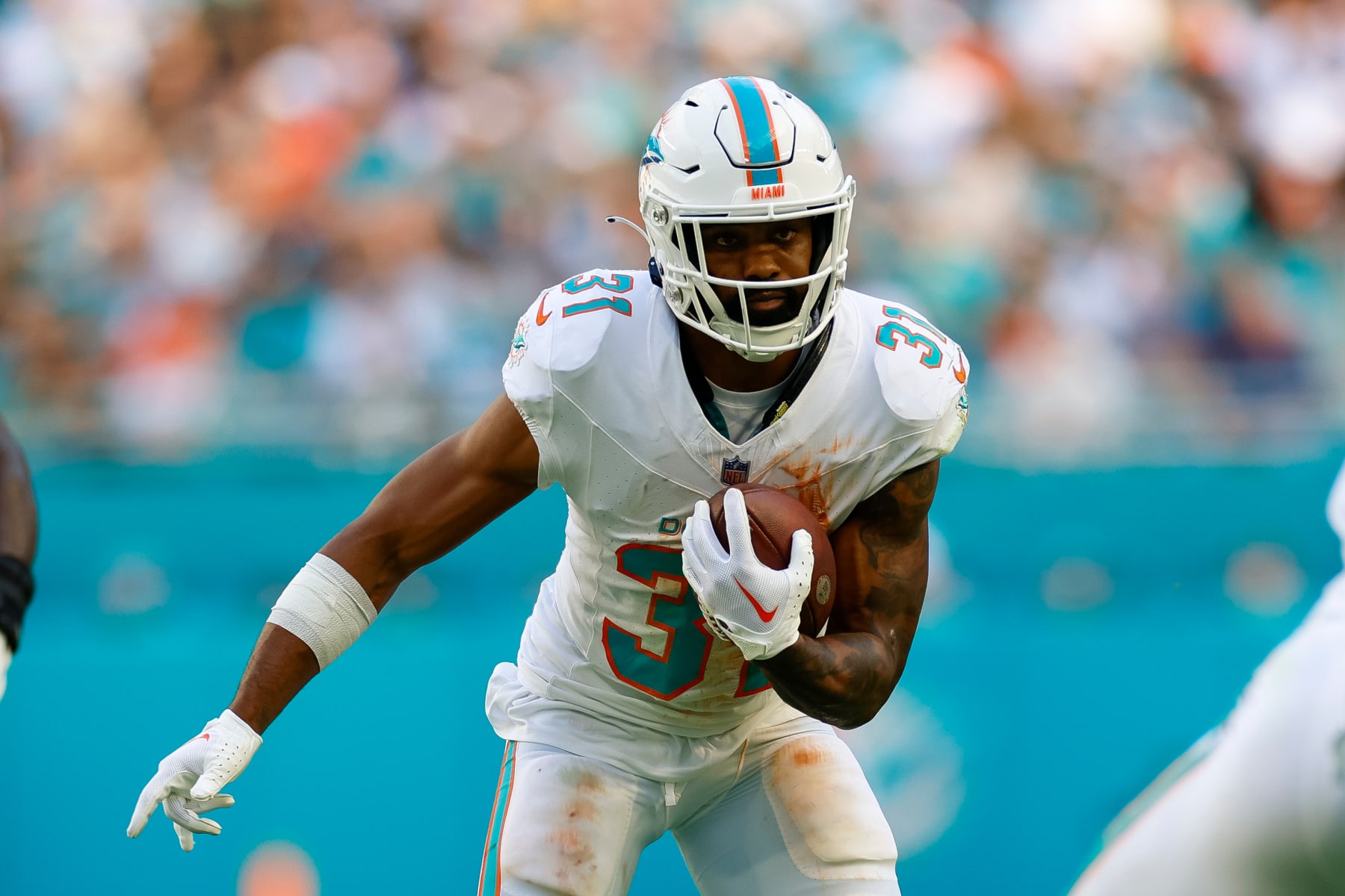 MIAMI GARDENS, FLORIDA - DECEMBER 17: Raheem Mostert #31 of the Miami Dolphins runs with the ball in the first half during a game against the New York Jets at Hard Rock Stadium on December 17, 2023 in Miami Gardens, Florida. (Photo by Brandon Sloter/Image Of Sport/Getty Images)