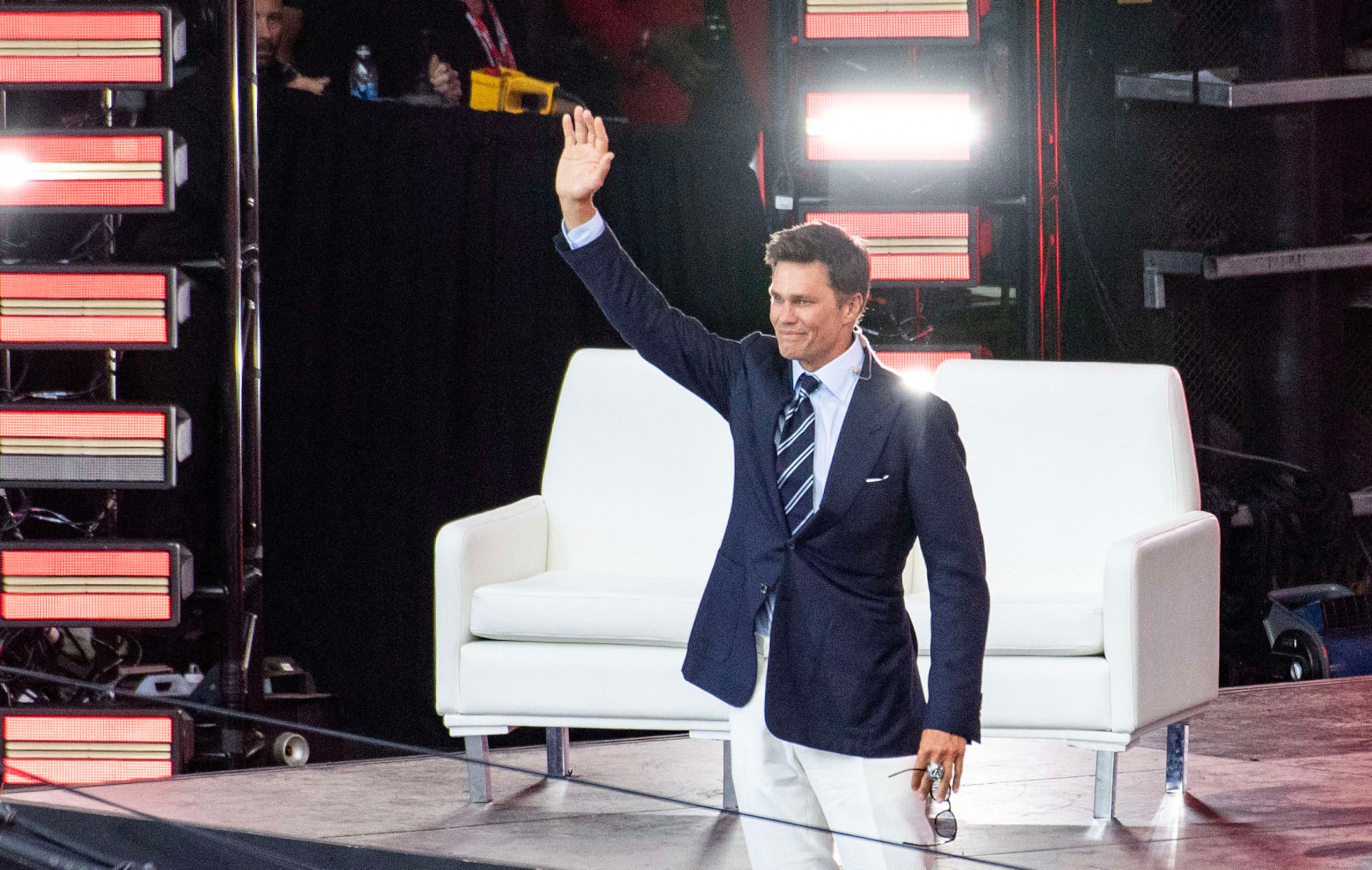 Former New England Patriots quarterback Tom Brady waves from stage during his 2024 Hall of Fame induction ceremony at Gillette Stadium in Foxborough, Massachusetts, on June 12, 2024. (Photo by Joseph Prezioso / AFP) (Photo by JOSEPH PREZIOSO/AFP via Getty Images)