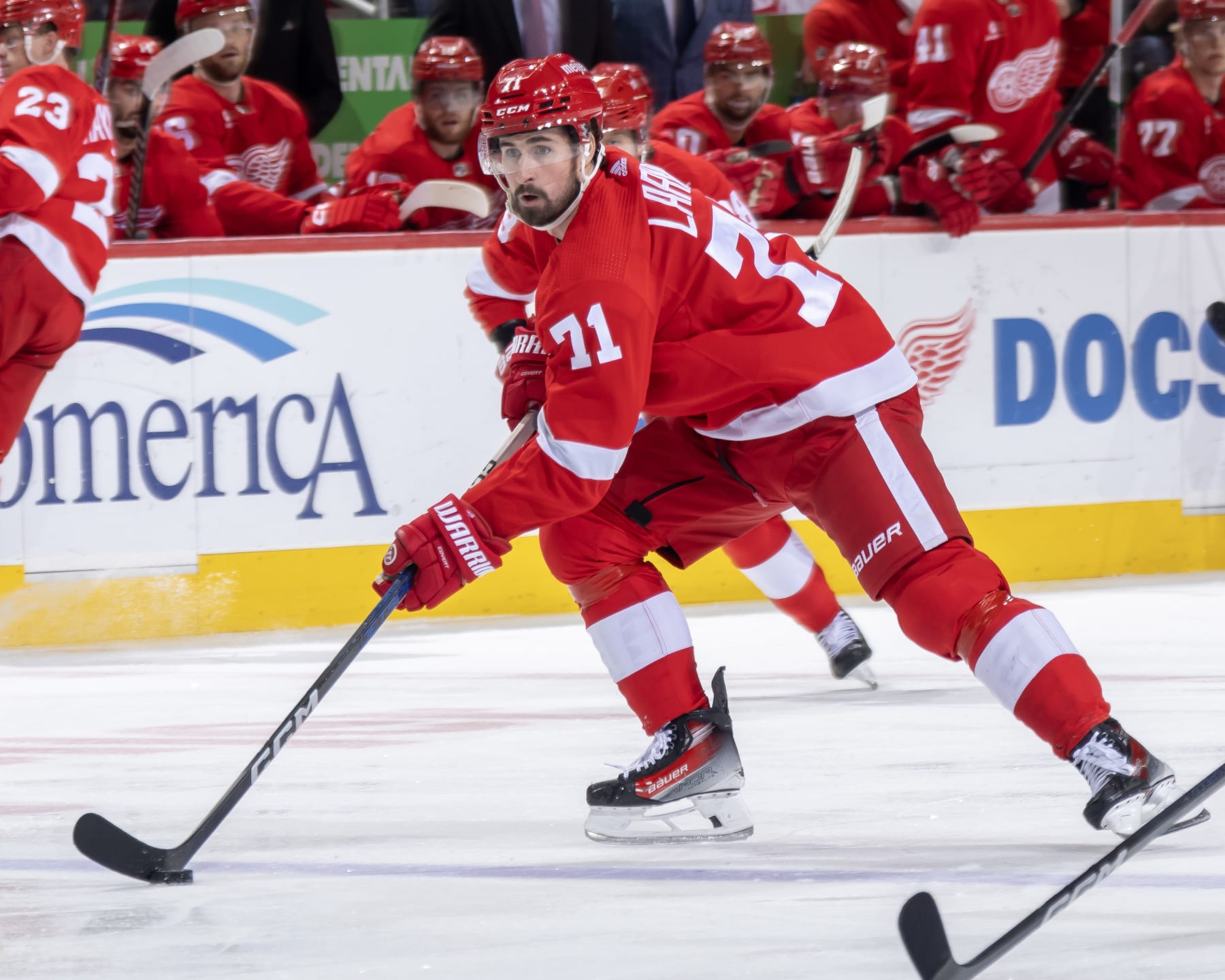 DETROIT, MI - APRIL 09: Dylan Larkin #71 of the Detroit Red Wings skates up ice with the puck against the Washington Capitals during the first period at Little Caesars Arena on April 9, 2024 in Detroit, Michigan. Washington defeated Detroit 2-1. (Photo by Dave Reginek/NHLI via Getty Images)