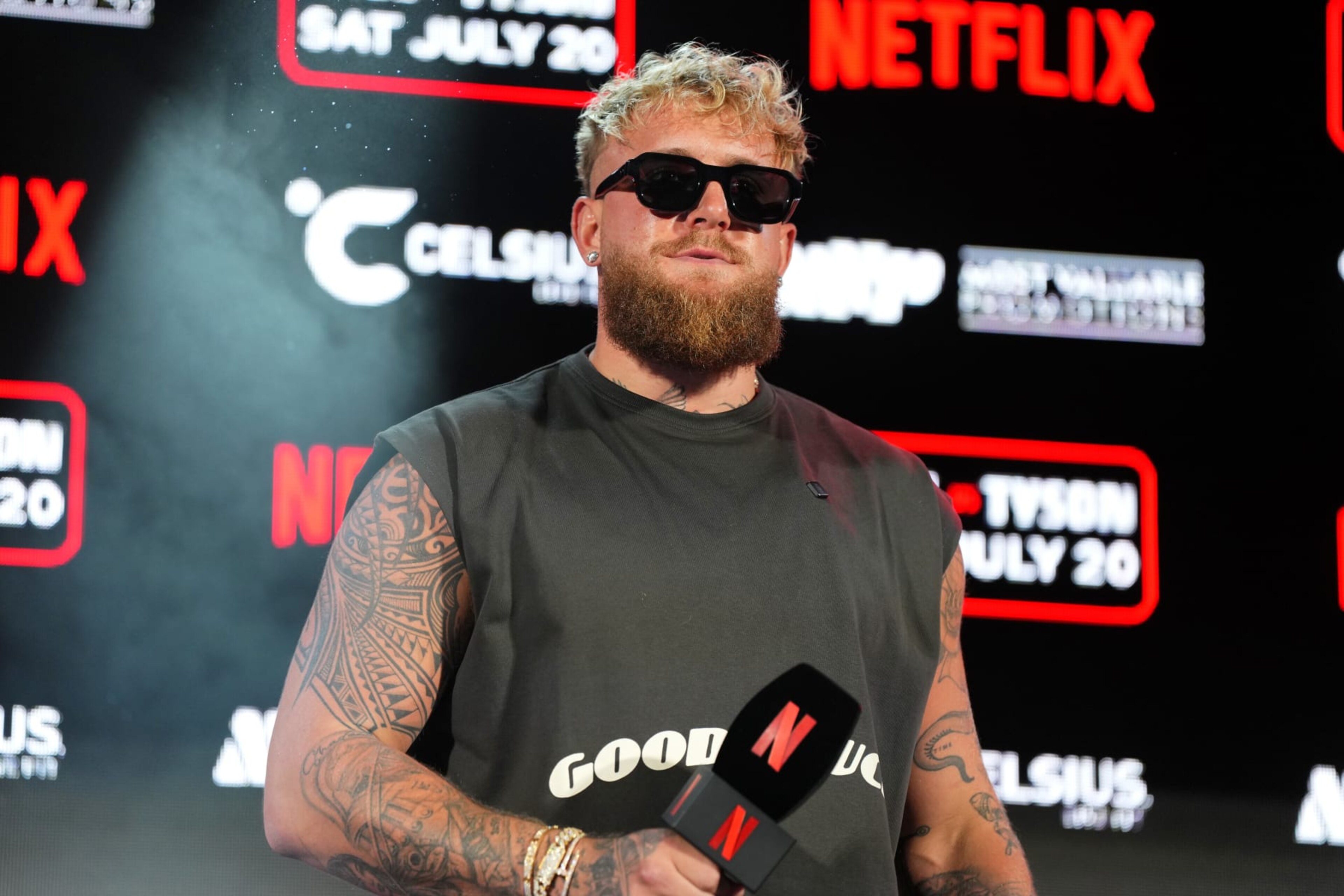ARLINGTON, TEXAS - MAY 16: Jake Paul speaks onstage during the Jake Paul vs. Mike Tyson Boxing match Arlington press conference at Texas Live! on May 16, 2024 in Arlington, Texas. (Photo by Cooper Neill/Getty Images for Netflix) ARLINGTON, TEXAS - MAY 16: Jake Paul speaks onstage during the Jake Paul vs. Mike Tyson Boxing match Arlington press conference at Texas Live! on May 16, 2024 in Arlington, Texas. (Photo by Cooper Neill/Getty Images for Netflix)
