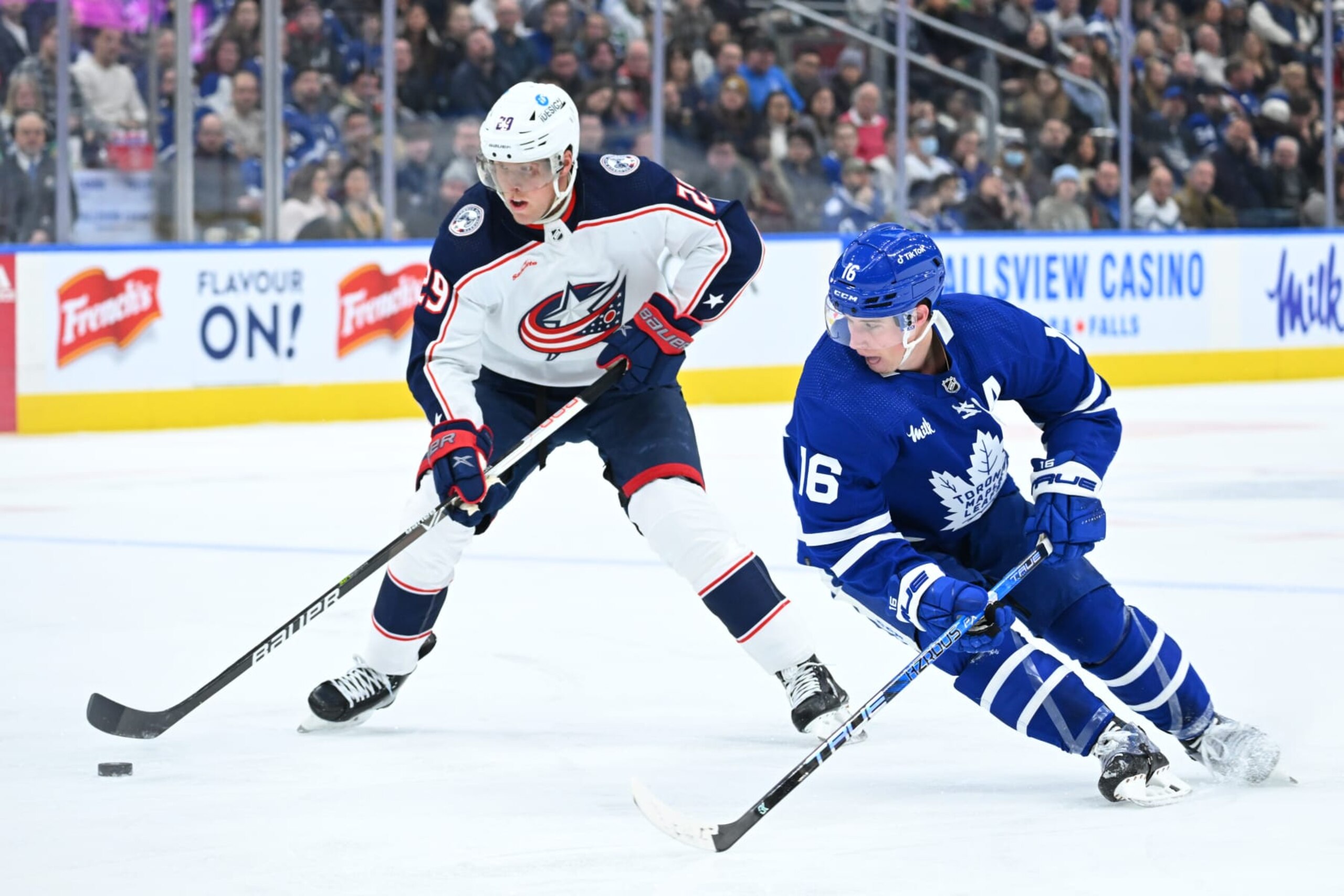 TORONTO, ON - FEBRUARY 11: Columbus Blue Jackets left wing Patrik Laine (29) skates past Toronto Maple Leafs right wing Mitchell Marner (16) in the first period during the NHL regular season game between the Columbus Blue Jackets and the Toronto Maple Leafs on February 11, 2023 at Scotiabank Arena in Toronto, ON. (Photo by Gavin Napier/Icon Sportswire via Getty Images)