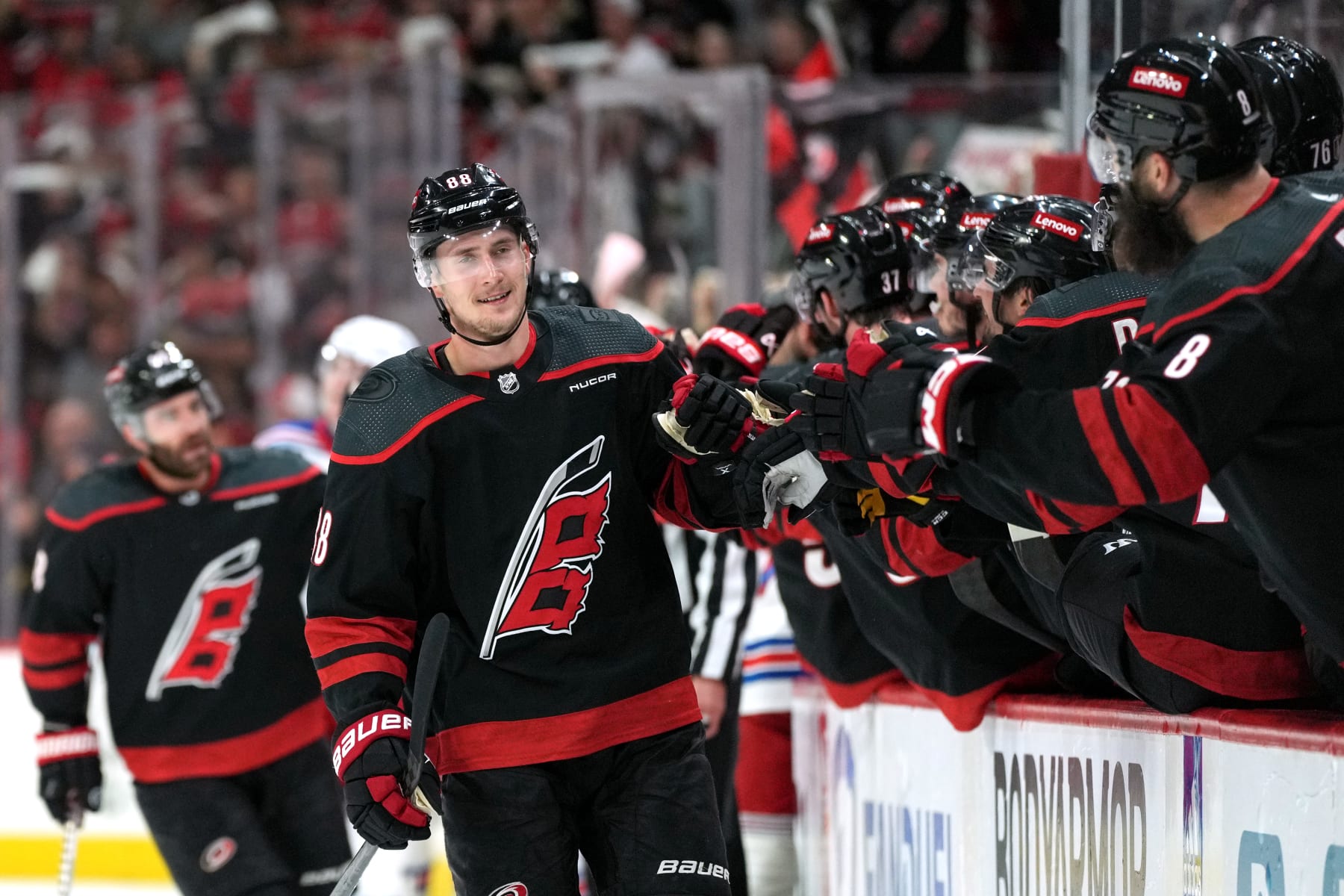 RALEIGH, NORTH CAROLINA - MAY 16: Martin Necas #88 of the Carolina Hurricanes celebrates a goal against the New York Rangers with teammates on the bench during the first period in Game Six of the Second Round of the 2024 Stanley Cup Playoffs at PNC Arena on May 16, 2024 in Raleigh, North Carolina.  (Photo by Grant Halverson/Getty Images)