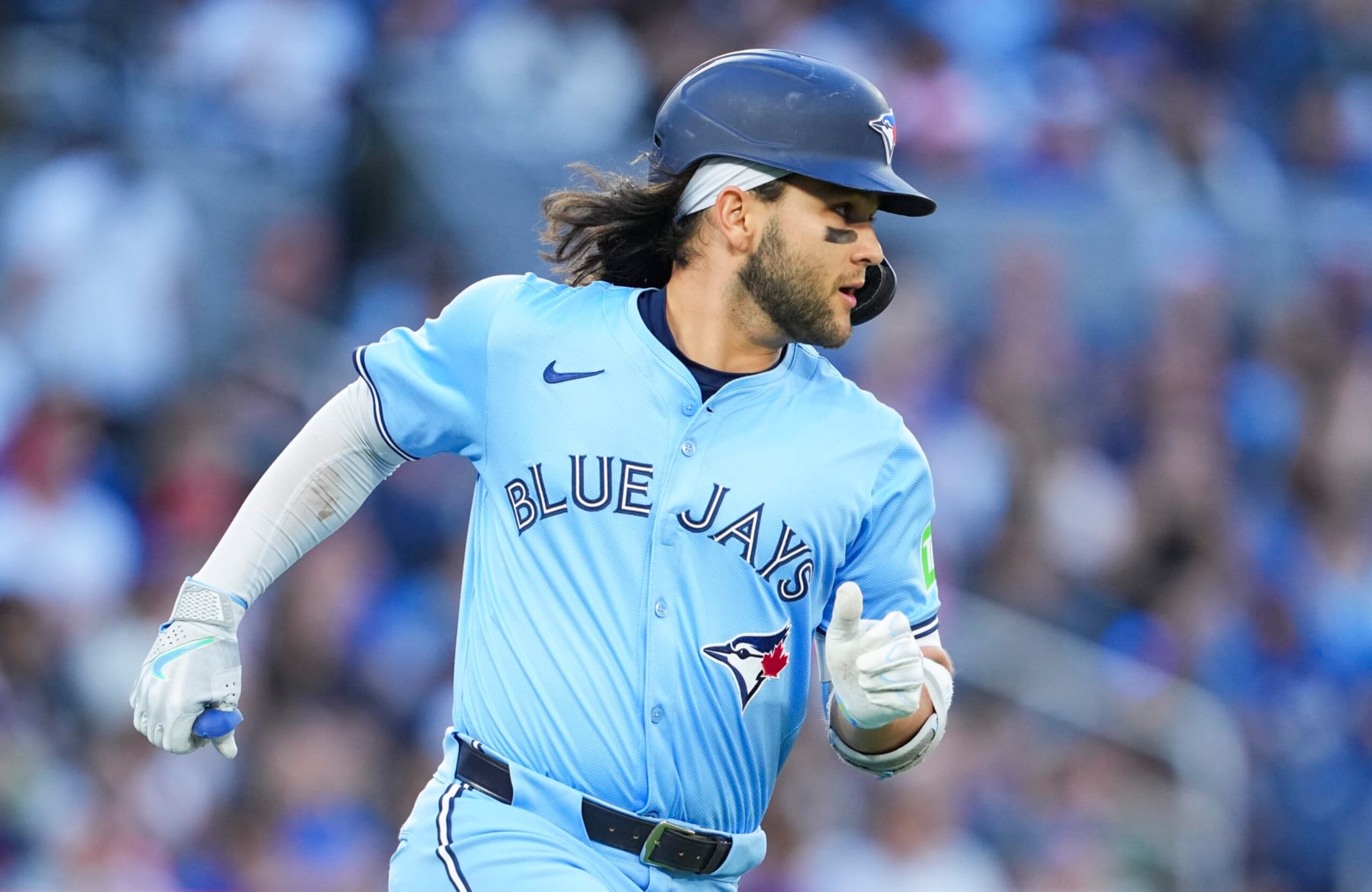 TORONTO, ON - JUNE 14: Bo Bichette #11 of Toronto Blue Jays runs to first base against the Cleveland Guardians during the fourth inning in their MLB game at the Rogers Centre on June 14, 2024 in Toronto, Ontario, Canada. (Photo by Mark Blinch/Getty Images)