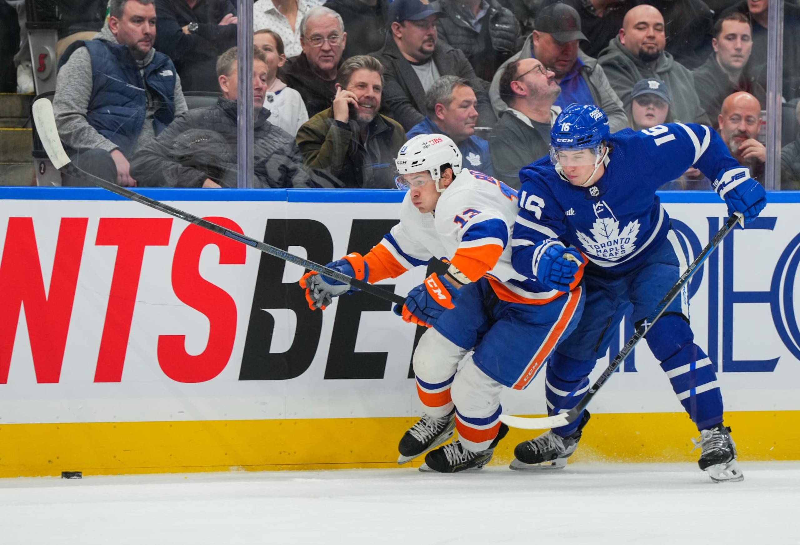 TORONTO, CANADA - FEBRUARY 05: Mathew Barzal #13 of the New York Islanders skates with the puck past Mitchell Marner #16 of the Toronto Maple Leafs during the first period at Scotiabank Arena on February 05, 2024 in Toronto, Ontario, Canada. (Photo by Chris Tanouye/Getty Images) TORONTO, CANADA - FEBRUARY 05: Mathew Barzal #13 of the New York Islanders skates with the puck past Mitchell Marner #16 of the Toronto Maple Leafs during the first period at Scotiabank Arena on February 05, 2024 in Toronto, Ontario, Canada. (Photo by Chris Tanouye/Getty Images)