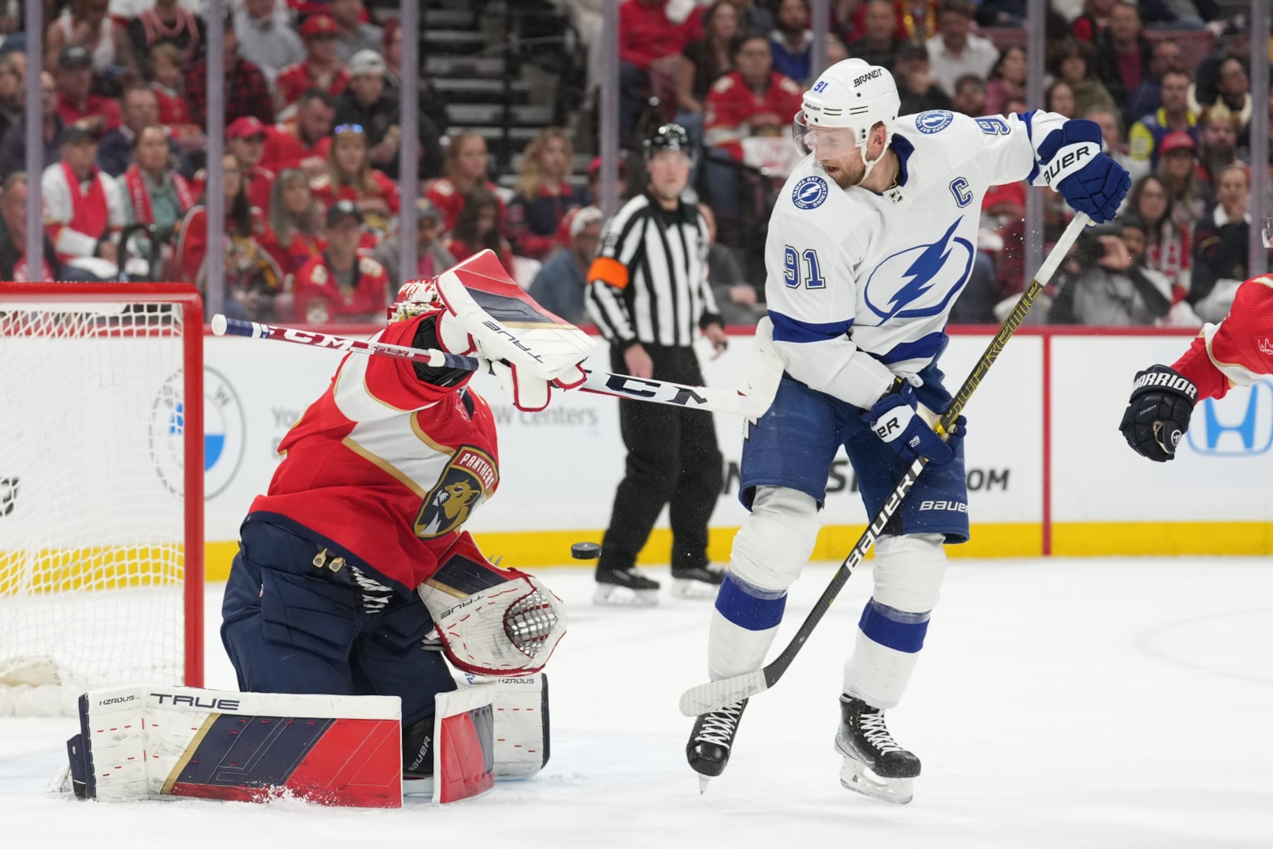 SUNRISE, FL - APRIL 29: Florida Panthers goaltender Sergei Bobrovsky (72) makes a save as Tampa Bay Lightning center Steven Stamkos (91) tries to deflect the puck in goal in the first periodduring game four of the Eastern Conference First Round between the Tampa Bay Lightning and the Florida Panthers at Amerant Bank Arena, Sunrise, Fla. (Photo by Peter Joneleit/Icon Sportswire via Getty Images) SUNRISE, FL - APRIL 29: Florida Panthers goaltender Sergei Bobrovsky (72) makes a save as Tampa Bay Lightning center Steven Stamkos (91) tries to deflect the puck in goal in the first periodduring game four of the Eastern Conference First Round between the Tampa Bay Lightning and the Florida Panthers at Amerant Bank Arena, Sunrise, Fla. (Photo by Peter Joneleit/Icon Sportswire via Getty Images)