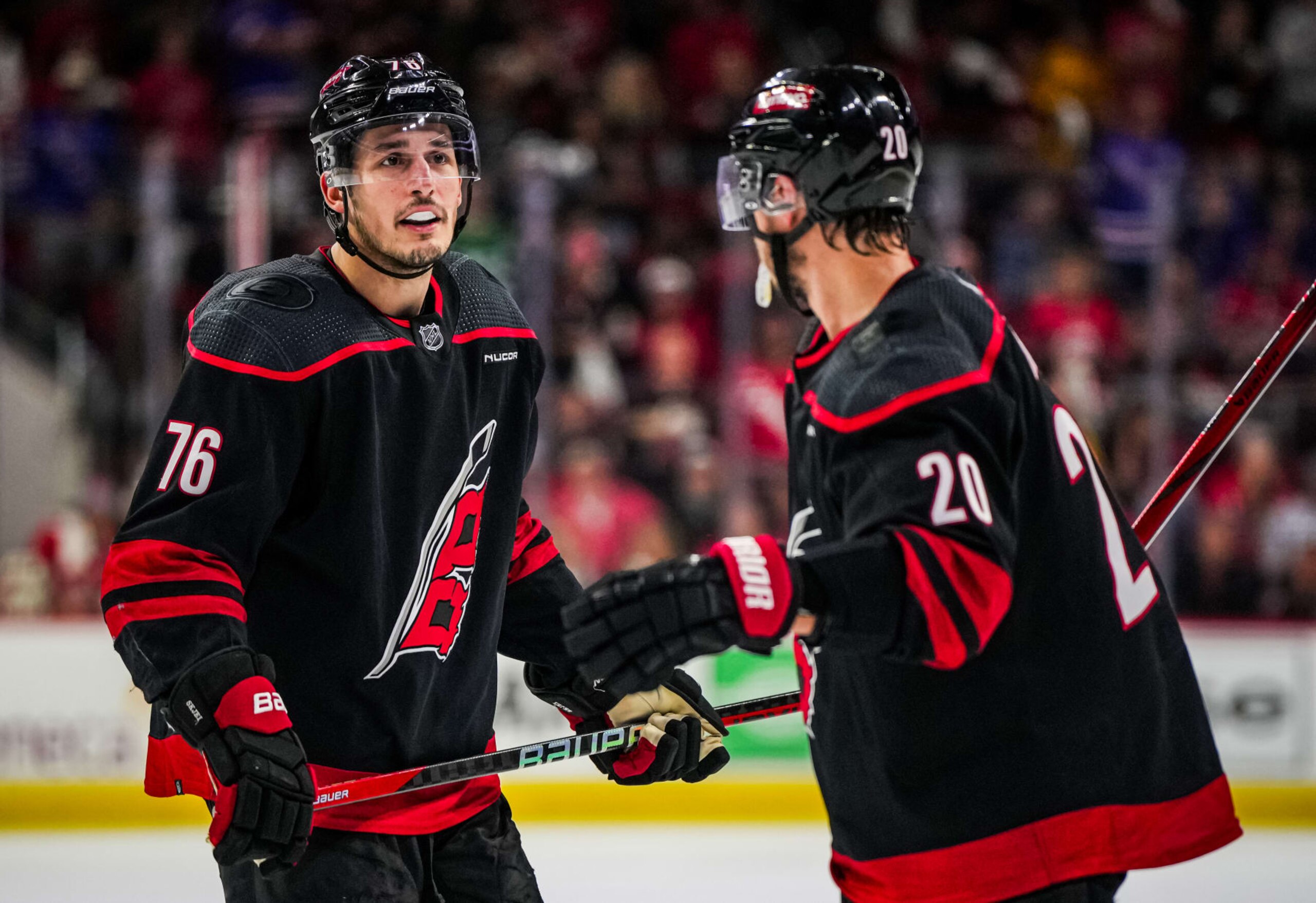 RALEIGH, NORTH CAROLINA - MAY 16: Brady Skjei #76 of the Carolina Hurricanes talks with Sebastian Aho #20 during the third period against the New York Rangers in Game Six of the Second Round of the 2024 Stanley Cup Playoffs at PNC Arena on May 16, 2024 in Raleigh, North Carolina. (Photo by Josh Lavallee/NHLI via Getty Images) RALEIGH, NORTH CAROLINA - MAY 16: Brady Skjei #76 of the Carolina Hurricanes talks with Sebastian Aho #20 during the third period against the New York Rangers in Game Six of the Second Round of the 2024 Stanley Cup Playoffs at PNC Arena on May 16, 2024 in Raleigh, North Carolina. (Photo by Josh Lavallee/NHLI via Getty Images)