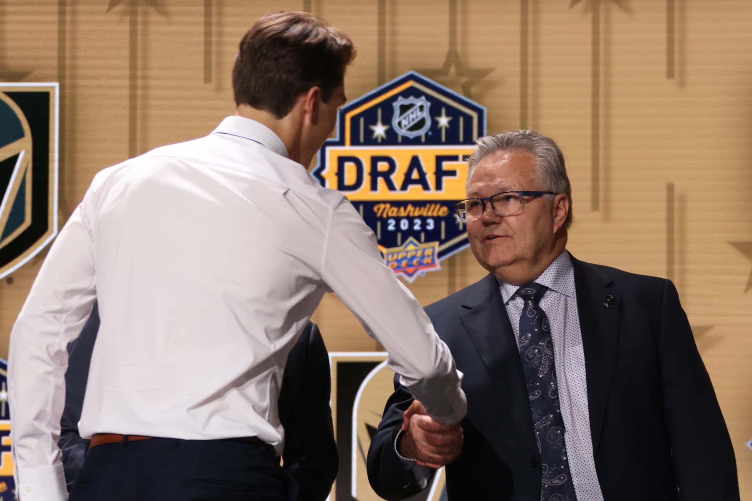 NASHVILLE, TENNESSEE - JUNE 28: David Edstrom shakes the hand of general manager Kelly McCrimmon of the Vegas Golden Knights onstage after being selected 32nd overall by the Vegas Golden Knights during the 2023 Upper Deck NHL Draft - Round One at Bridgestone Arena on June 28, 2023 in Nashville, Tennessee. (Photo by Dave Sandford/NHLI via Getty Images) NASHVILLE, TENNESSEE - JUNE 28: David Edstrom shakes the hand of general manager Kelly McCrimmon of the Vegas Golden Knights onstage after being selected 32nd overall by the Vegas Golden Knights during the 2023 Upper Deck NHL Draft - Round One at Bridgestone Arena on June 28, 2023 in Nashville, Tennessee. (Photo by Dave Sandford/NHLI via Getty Images)