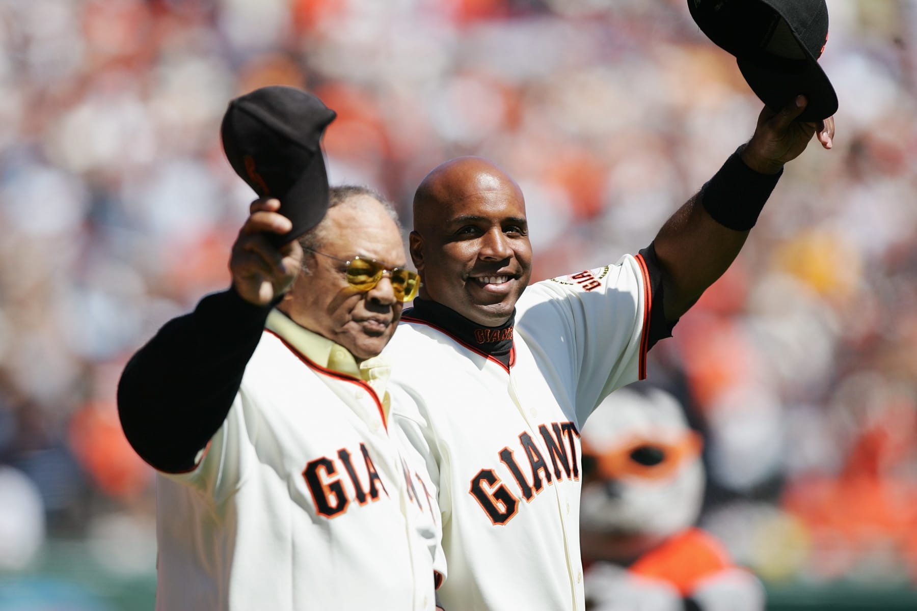 SAN FRANCISCO - APRIL 3:  Willie Mays and Barry Bonds #25 of the San Francisco Giants wave to the crowd before the Opening Day game against the San Diego Padres on April 3, 2007 at AT&T Park in San Francisco, California. The Padres won 7-0. (Photo by Jed Jacobsohn/Getty Images)