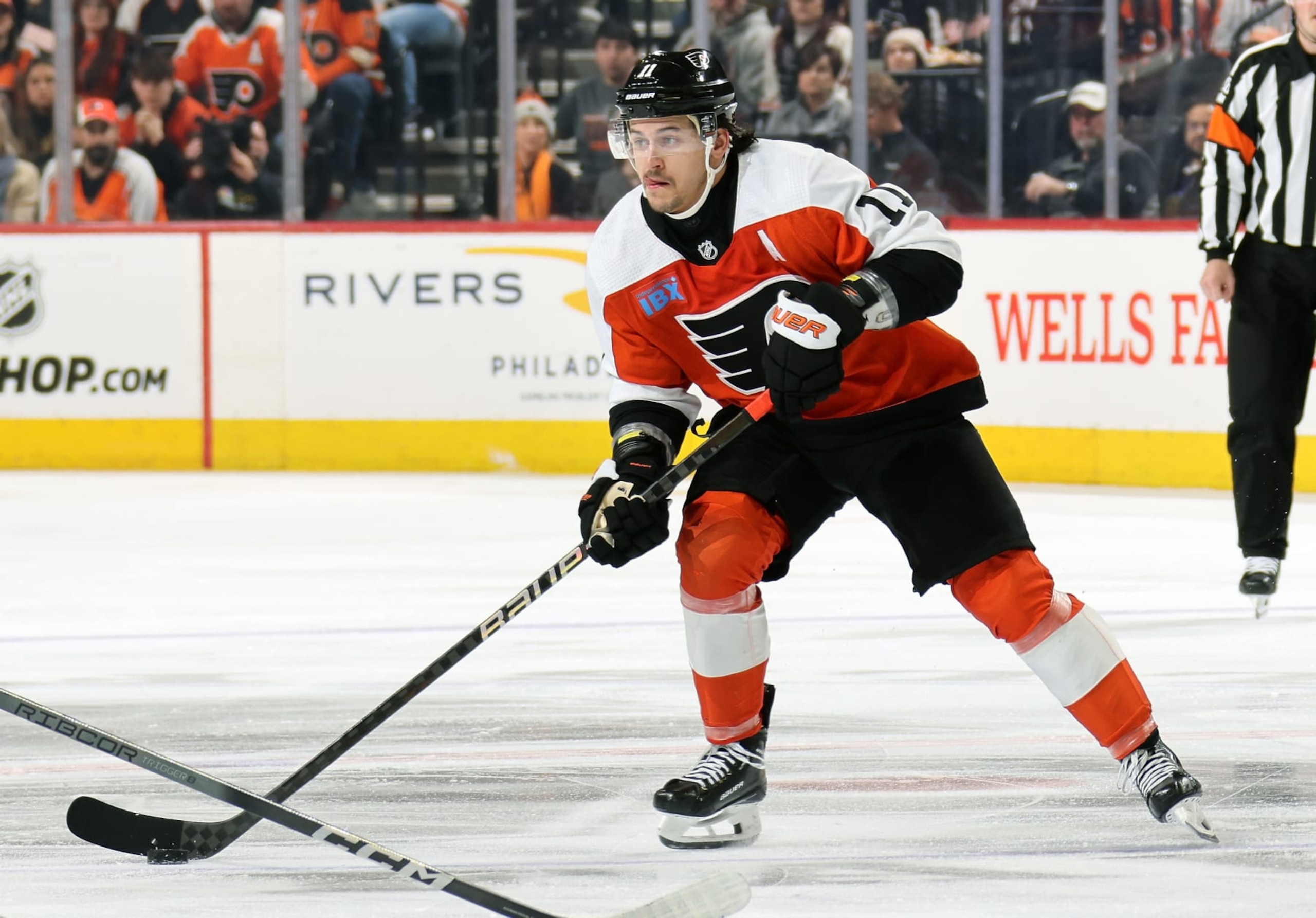 PHILADELPHIA, PENNSYLVANIA - MARCH 12:  Travis Konecny #11 of the Philadelphia Flyers skates the puck against the San Jose Sharks at the Wells Fargo Center on March 12, 2024 in Philadelphia, Pennsylvania.  (Photo by Len Redkoles/NHLI via Getty Images)