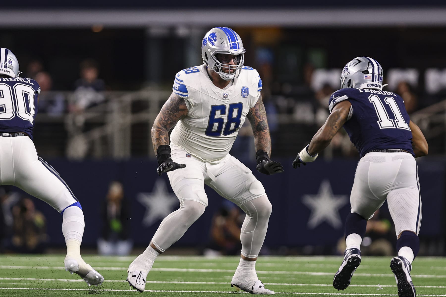 ARLINGTON, TX - DECEMBER 30: Taylor Decker #68 of the Detroit Lions drops back to block during an NFL football game against the Dallas Cowboys at AT&T Stadium on December 30, 2023 in Arlington, Texas. (Photo by Perry Knotts/Getty Images)