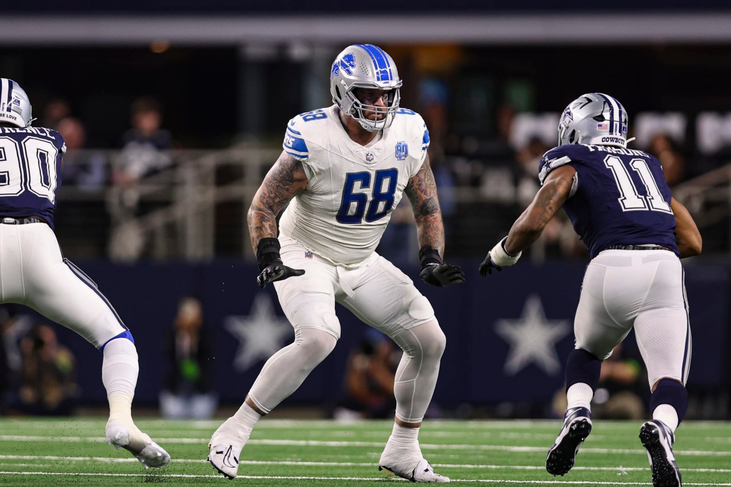 ARLINGTON, TX - DECEMBER 30: Taylor Decker #68 of the Detroit Lions drops back to block during an NFL football game against the Dallas Cowboys at AT&T Stadium on December 30, 2023 in Arlington, Texas. (Photo by Perry Knotts/Getty Images)