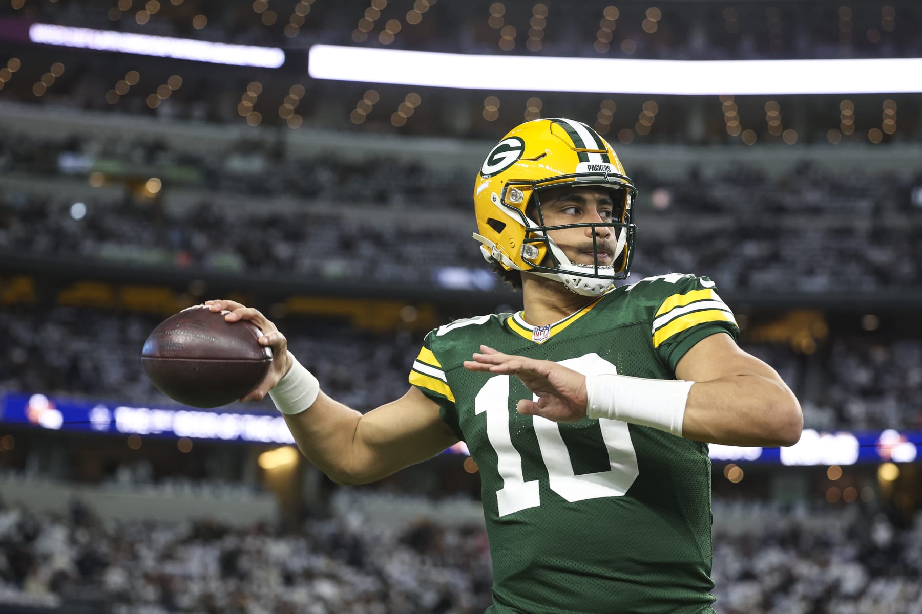 ARLINGTON, TX - JANUARY 14: Jordan Love #10 of the Green Bay Packers warms up prior to an NFL wild-card playoff football game against the Dallas Cowboys at AT&T Stadium on January 14, 2024 in Arlington, Texas. (Photo by Perry Knotts/Getty Images)