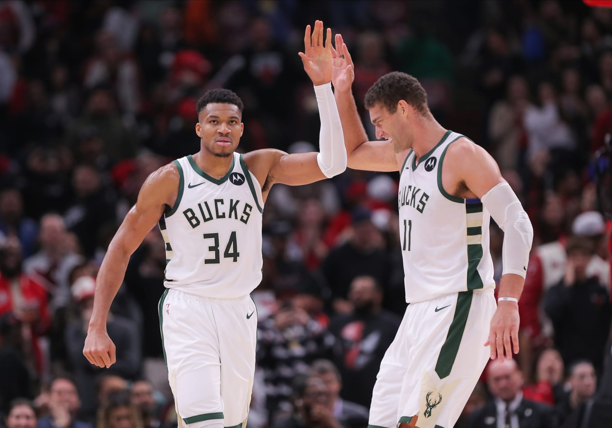 CHICAGO, IL - NOVEMBER 30: Brook Lopez #11 of the Milwaukee Bucks high-fives Giannis Antetokounmpo #34 of the Milwaukee Bucks after a block during the second half against the Chicago Bulls at the United Center on November 30, 2023 in Chicago, Illinois. (Photo by Melissa Tamez/Icon Sportswire via Getty Images)