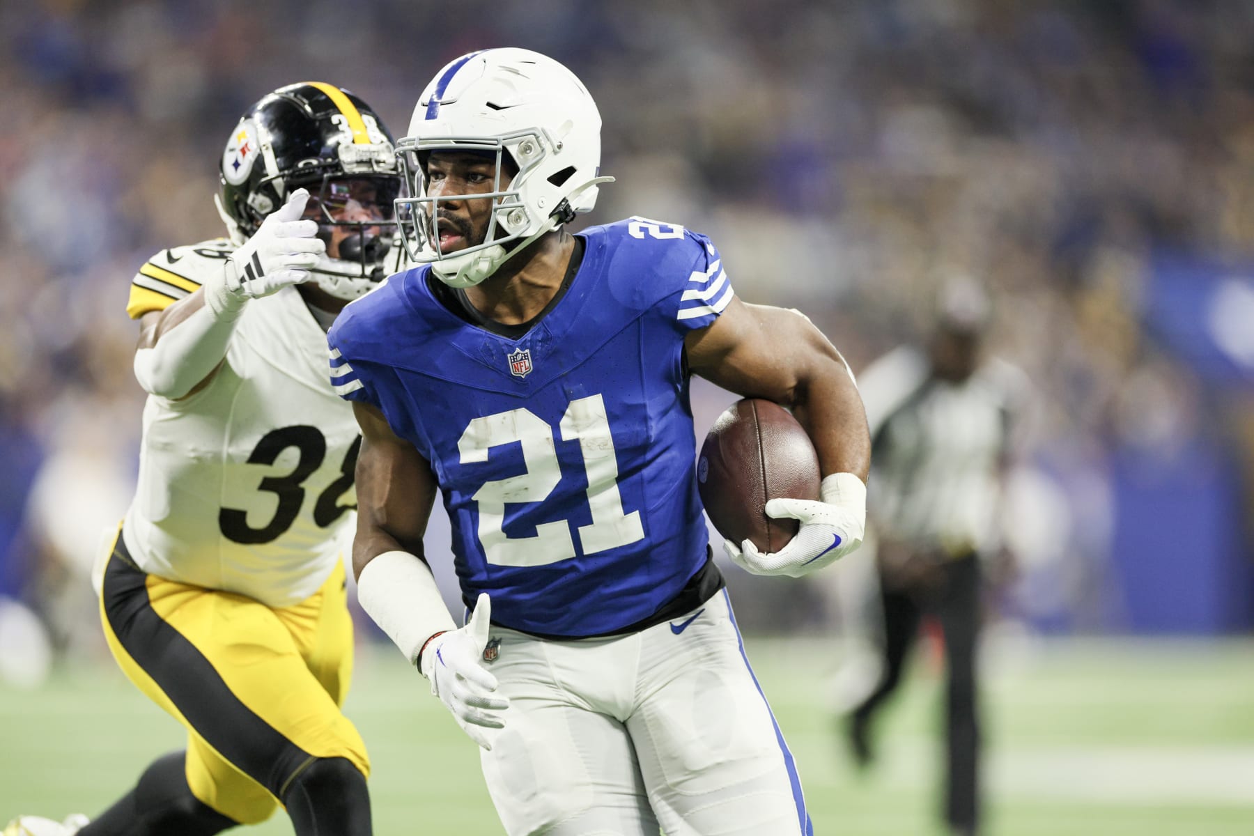 INDIANAPOLIS, INDIANA - DECEMBER 16: Mykal Walker #38 of the Pittsburgh Steelers tackles Zack Moss #21 of the Indianapolis Colts while Moss scores a receiving touchdown during the second quarter at Lucas Oil Stadium on December 16, 2023 in Indianapolis, Indiana. (Photo by Andy Lyons/Getty Images)