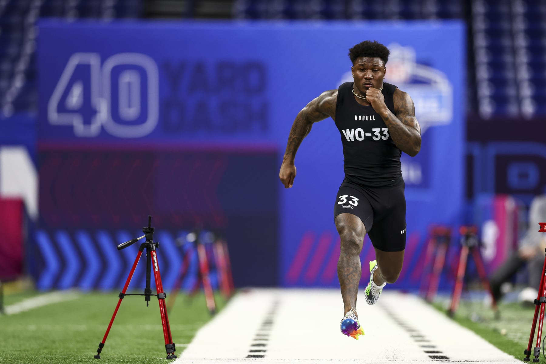 INDIANAPOLIS, INDIANA - MARCH 2: Malik Washington #WO33 of Virginia runs the 40-yard dash during the NFL Combine at the Lucas Oil Stadium on March 2, 2024 in Indianapolis, Indiana. (Photo by Kevin Sabitus/Getty Images)