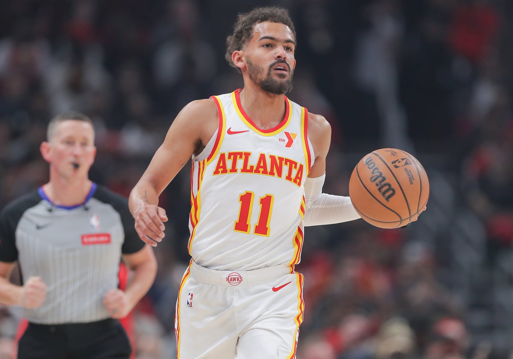 CHICAGO, IL - APRIL 17: Trae Young #11 of the Atlanta Hawks brings the ball up court during first half of the 2024 Play-In Tournament against the Chicago Bulls at the United Center on April 17, 2024  in Chicago, Illinois. (Photo by Melissa Tamez/Icon Sportswire via Getty Images)