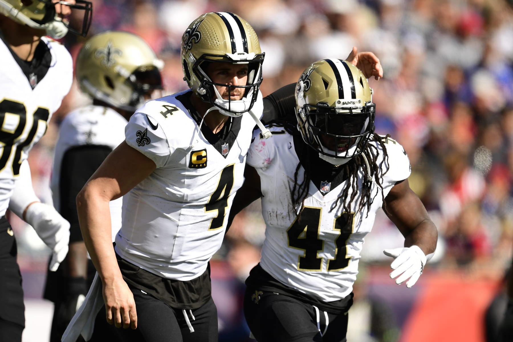 FOXBOROUGH, MASSACHUSETTS - OCTOBER 08: Derek Carr #4 of the New Orleans Saints and Alvin Kamara #41 of the New Orleans Saints celebrate after Kamara's rushing touchdown during the second quarter against the New England Patriots at Gillette Stadium on October 08, 2023 in Foxborough, Massachusetts. (Photo by Maddie Malhotra/Getty Images)