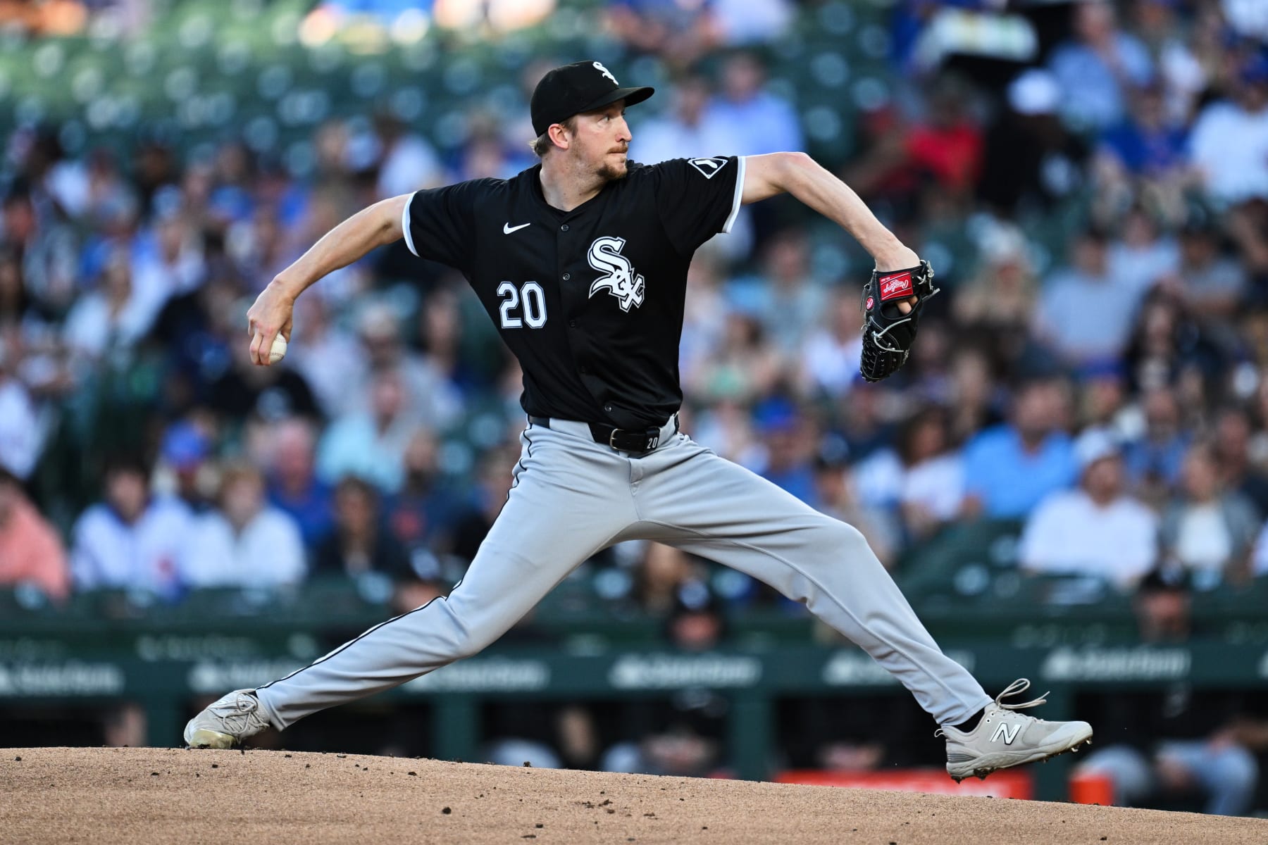 CHICAGO, IL - JUNE 05:  Erick Fedde #20 of the Chicago White Sox pitches in the first inning against the Chicago Cubs at Wrigley Field on June 05, 2024 in Chicago, Illinois.  (Photo by Jamie Sabau/Getty Images)