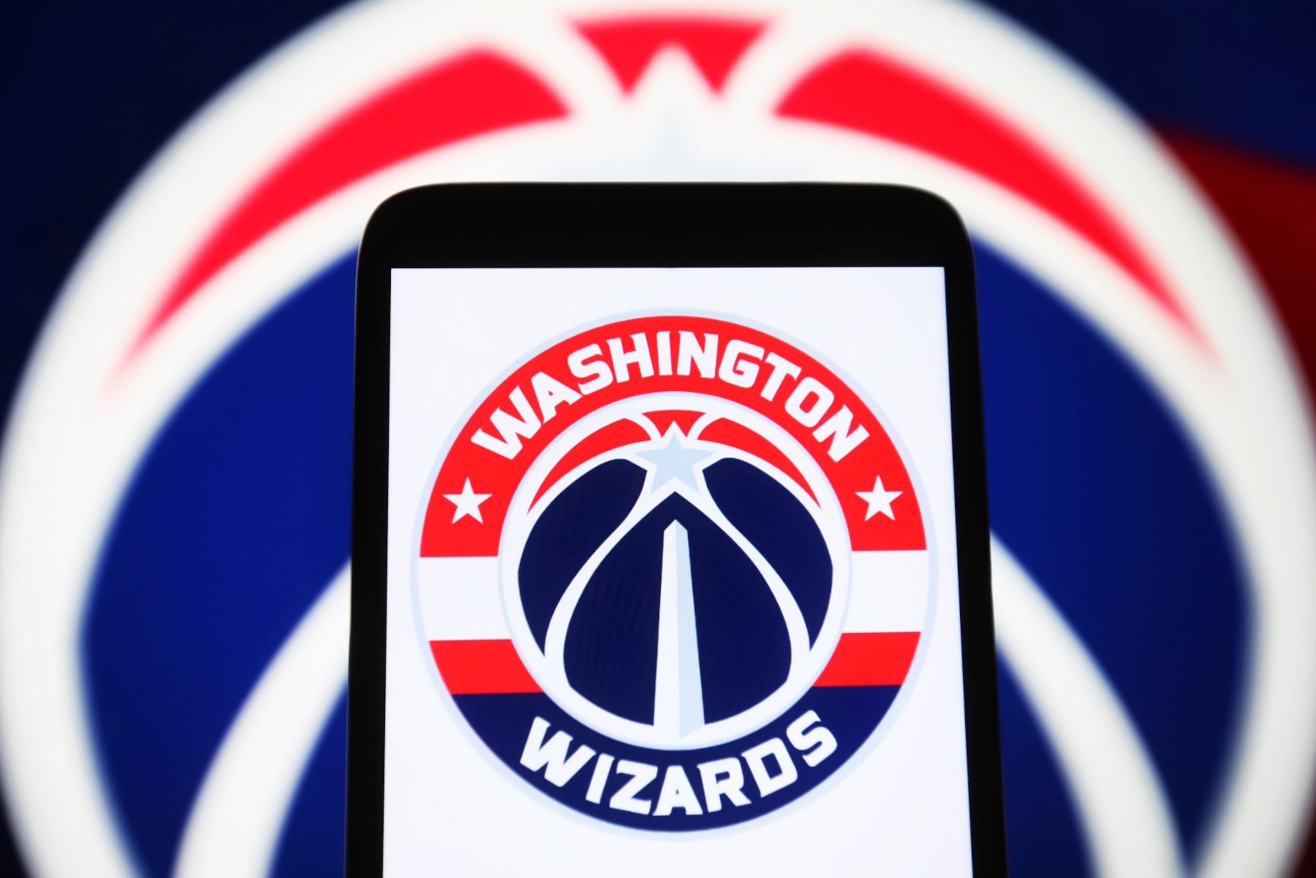 UKRAINE - 2024/01/05: In this photo illustration, the Washington Wizards logo is seen on a smartphone screen. (Photo Illustration by Pavlo Gonchar/SOPA Images/LightRocket via Getty Images) UKRAINE - 2024/01/05: In this photo illustration, the Washington Wizards logo is seen on a smartphone screen. (Photo Illustration by Pavlo Gonchar/SOPA Images/LightRocket via Getty Images)