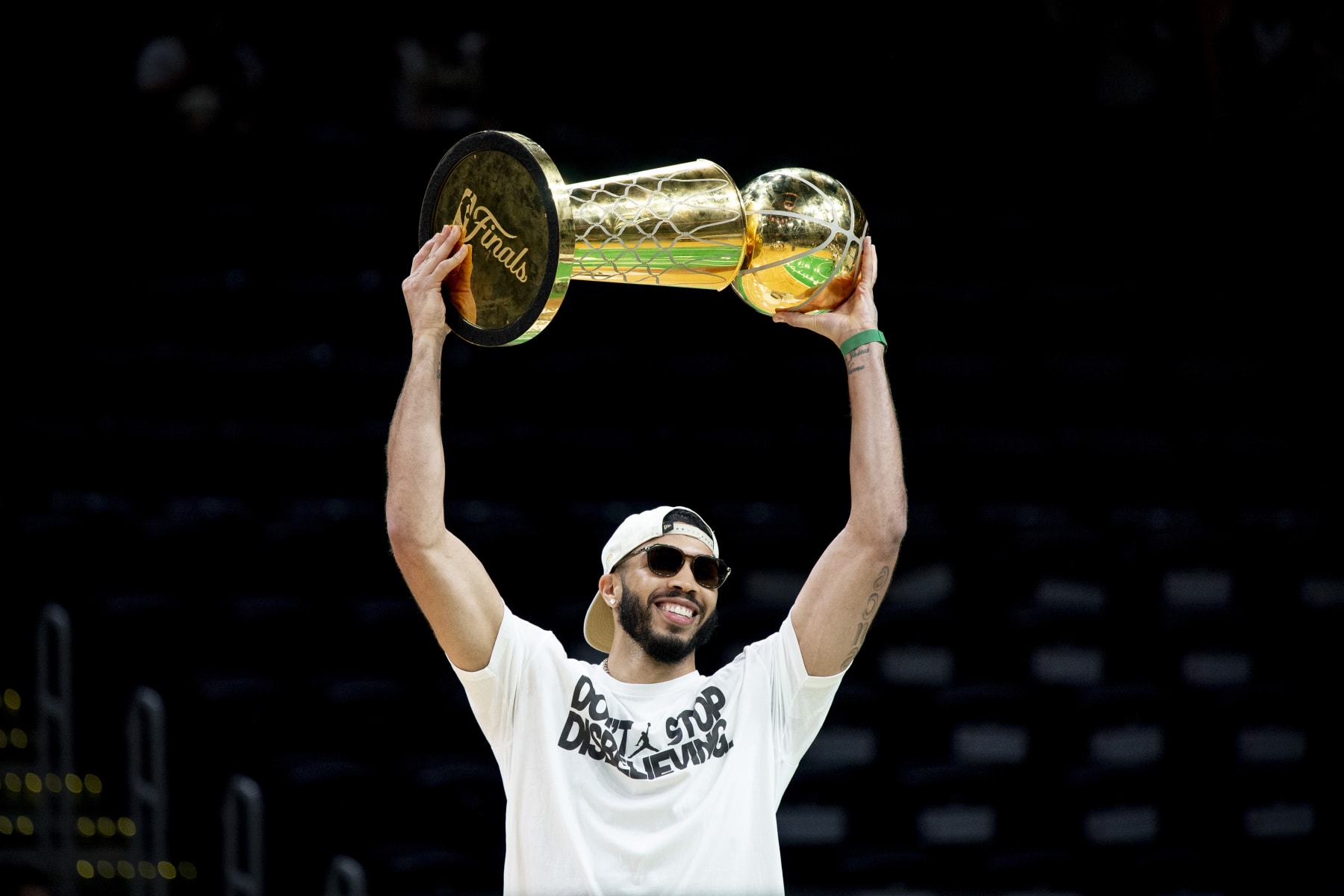 BOSTON, MASSACHUSETTS - JUNE 21: Jayson Tatum #0 of the Boston Celtics hoists the Larry O'Brien trophy as he is introduced during the Boston Celtics Victory Event following their 2024 NBA Finals win at TD Garden on June 21, 2024 in Boston, Massachusetts. (Photo by Maddie Malhotra/Getty Images)