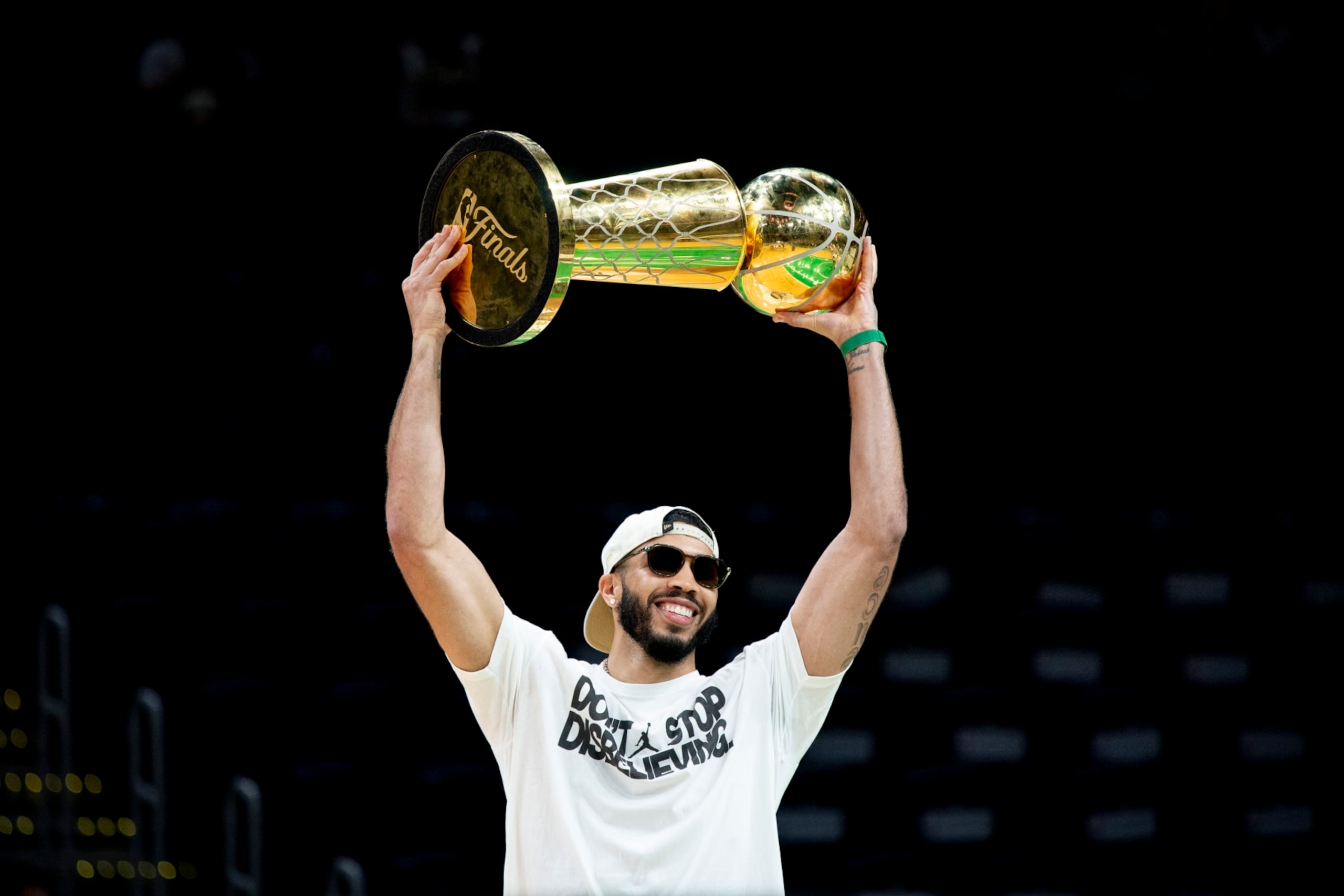 BOSTON, MASSACHUSETTS - JUNE 21: Jayson Tatum #0 of the Boston Celtics hoists the Larry O'Brien trophy as he is introduced during the Boston Celtics Victory Event following their 2024 NBA Finals win at TD Garden on June 21, 2024 in Boston, Massachusetts. (Photo by Maddie Malhotra/Getty Images)
