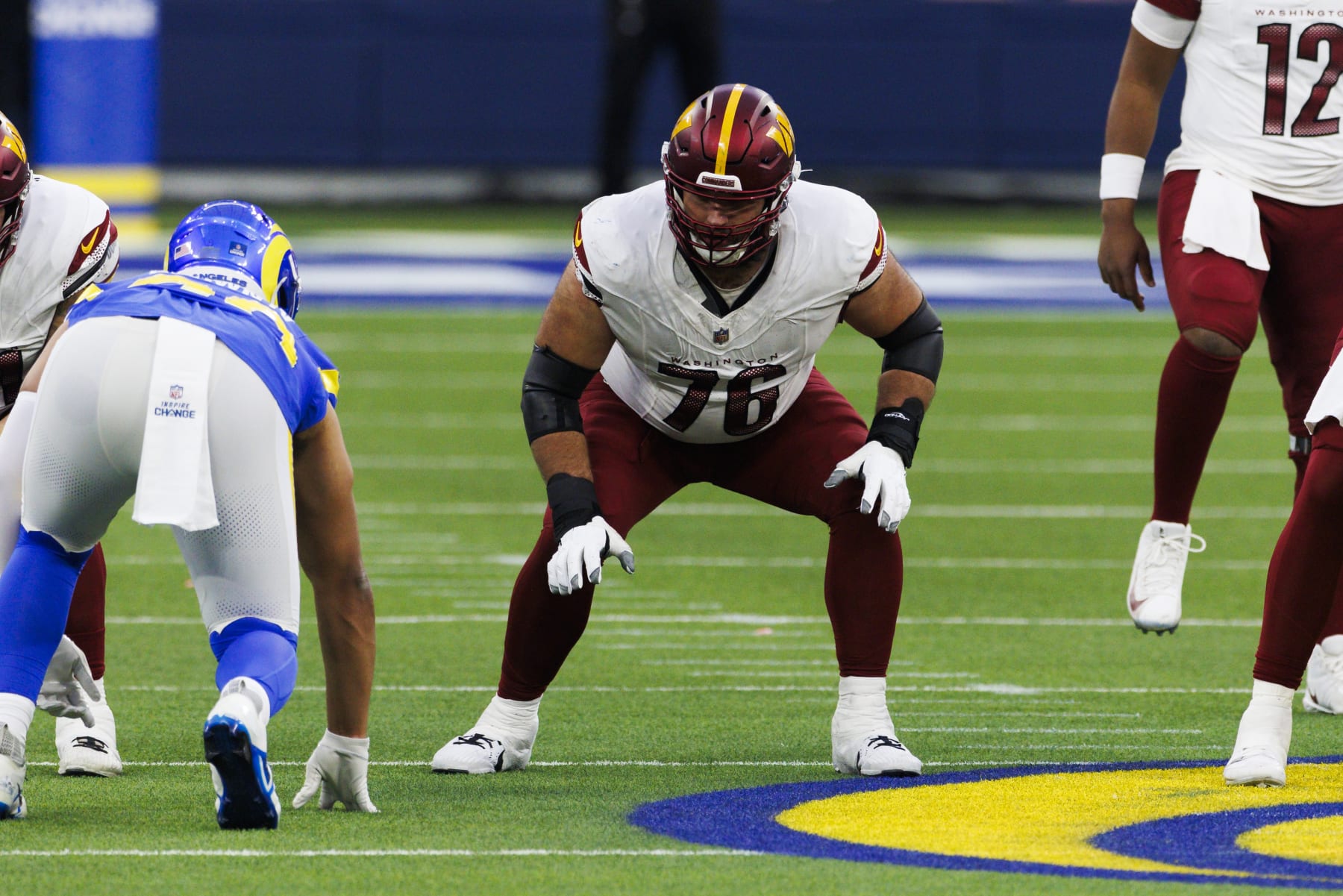 INGLEWOOD, CALIFORNIA - DECEMBER 17: Sam Cosmi #76 of the Washington Commanders in an offensive stance during a game against the Los Angeles Rams at SoFi Stadium on December 17, 2023 in Inglewood, California. (Photo by Ric Tapia/Getty Images)