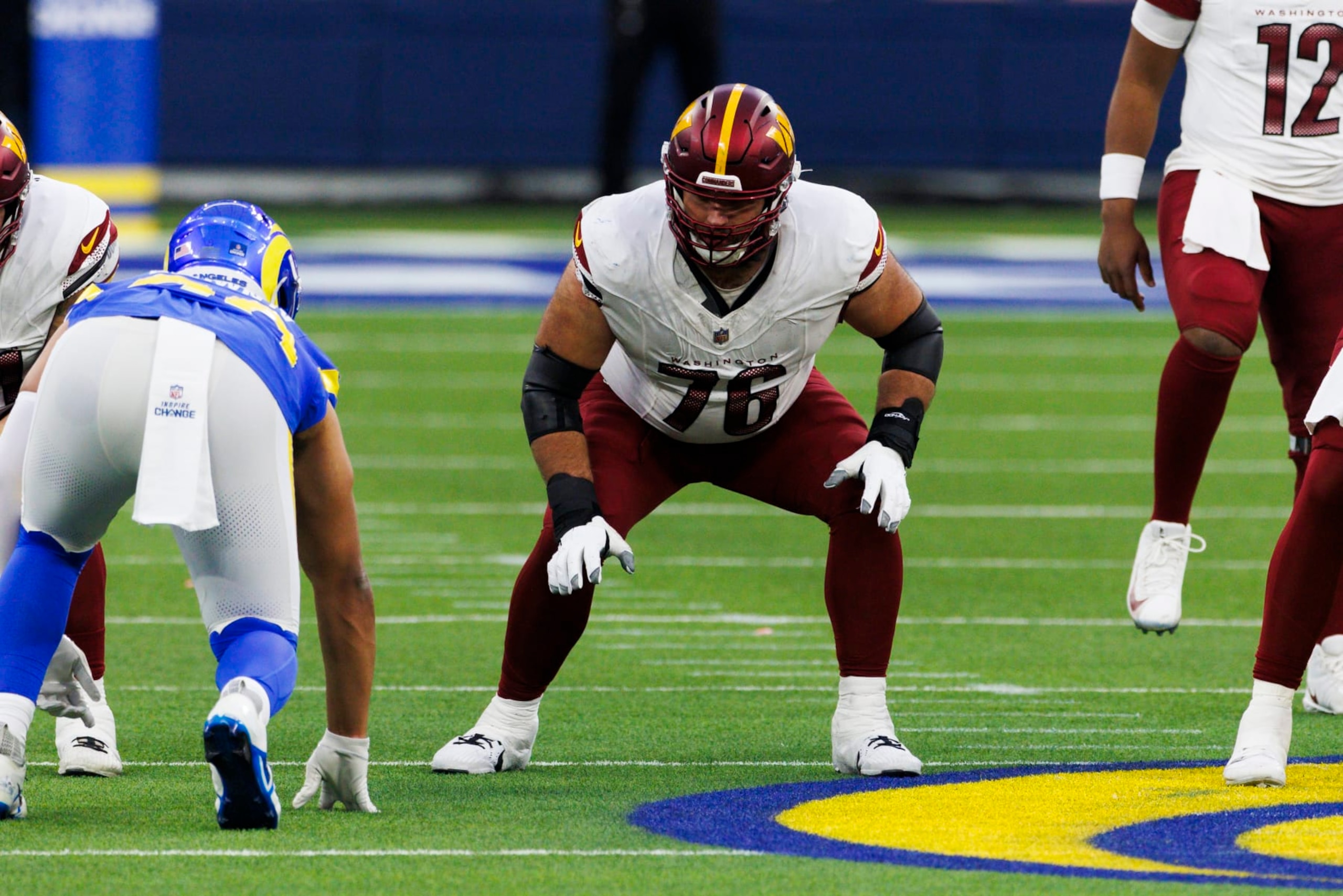 INGLEWOOD, CALIFORNIA - DECEMBER 17: Sam Cosmi #76 of the Washington Commanders in an offensive stance during a game against the Los Angeles Rams at SoFi Stadium on December 17, 2023 in Inglewood, California. (Photo by Ric Tapia/Getty Images)