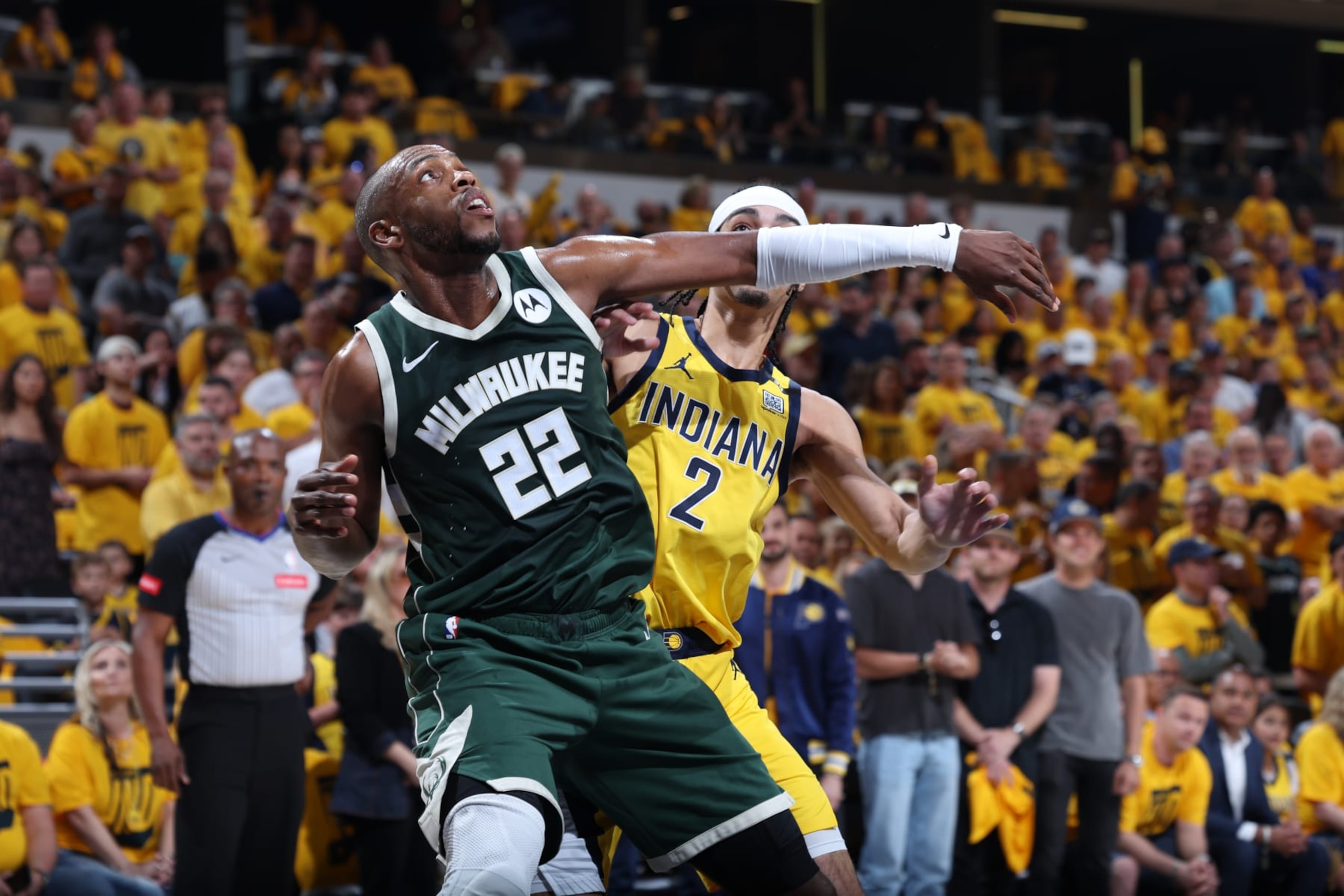 INDIANAPOLIS, IN - MAY 2: Khris Middleton #22 of the Milwaukee Bucks boxes out against Andrew Nembhard #2 of the Indiana Pacers during the game during Round 1 Game 6 of the 2024 NBA Playoffs on May 2, 2024 at Gainbridge Fieldhouse in Indianapolis, Indiana. NOTE TO USER: User expressly acknowledges and agrees that, by downloading and or using this Photograph, user is consenting to the terms and conditions of the Getty Images License Agreement. Mandatory Copyright Notice: Copyright 2024 NBAE (Photo by Jeff Haynes/NBAE via Getty Images) INDIANAPOLIS, IN - MAY 2: Khris Middleton #22 of the Milwaukee Bucks boxes out against Andrew Nembhard #2 of the Indiana Pacers during the game during Round 1 Game 6 of the 2024 NBA Playoffs on May 2, 2024 at Gainbridge Fieldhouse in Indianapolis, Indiana. NOTE TO USER: User expressly acknowledges and agrees that, by downloading and or using this Photograph, user is consenting to the terms and conditions of the Getty Images License Agreement. Mandatory Copyright Notice: Copyright 2024 NBAE (Photo by Jeff Haynes/NBAE via Getty Images)