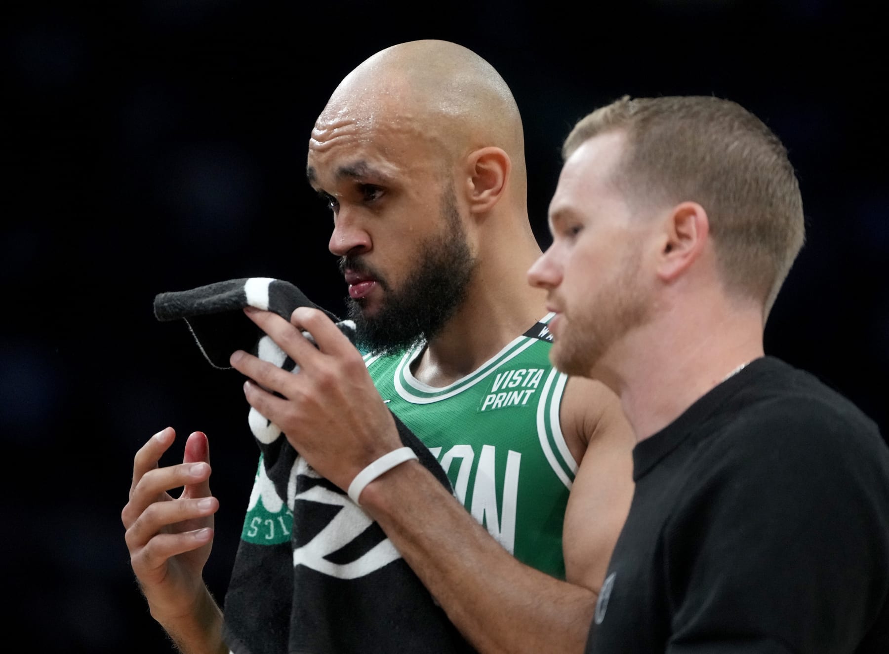 Boston, MA - June 17: Boston Celtics guard Derrick White walks to the bench after hitting his face on the court during the second quarter in Game 5 of the 2024 NBA Finals. (Photo by Barry Chin/The Boston Globe via Getty Images)