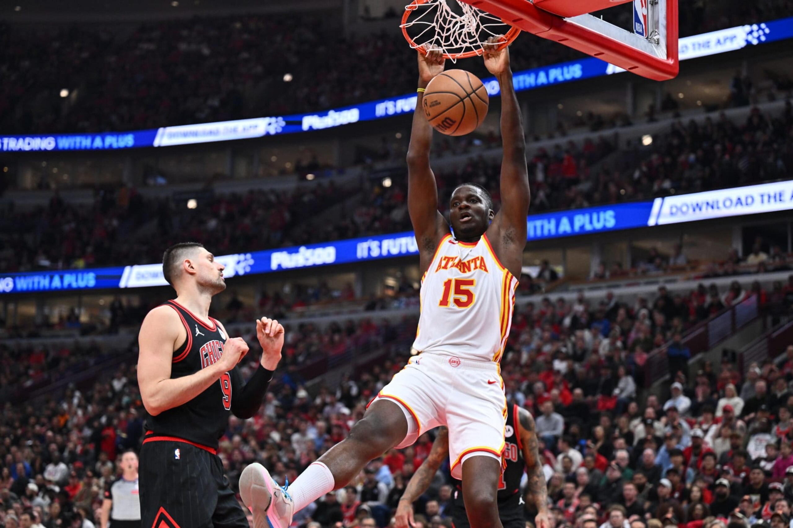 CHICAGO, ILLINOIS - APRIL 17: Clint Capela #15 of the Atlanta Hawks dunks the ball against Nikola Vucevic #9 of the Chicago Bulls in the first half during the play-in tournament on April 17, 2024 at United Center in Chicago, Illinois. NOTE TO USER: User expressly acknowledges and agrees that, by downloading and or using this photograph, User is consenting to the terms and conditions of the Getty Images License Agreement. (Photo by Jamie Sabau/Getty Images) CHICAGO, ILLINOIS - APRIL 17: Clint Capela #15 of the Atlanta Hawks dunks the ball against Nikola Vucevic #9 of the Chicago Bulls in the first half during the play-in tournament on April 17, 2024 at United Center in Chicago, Illinois. NOTE TO USER: User expressly acknowledges and agrees that, by downloading and or using this photograph, User is consenting to the terms and conditions of the Getty Images License Agreement. (Photo by Jamie Sabau/Getty Images)