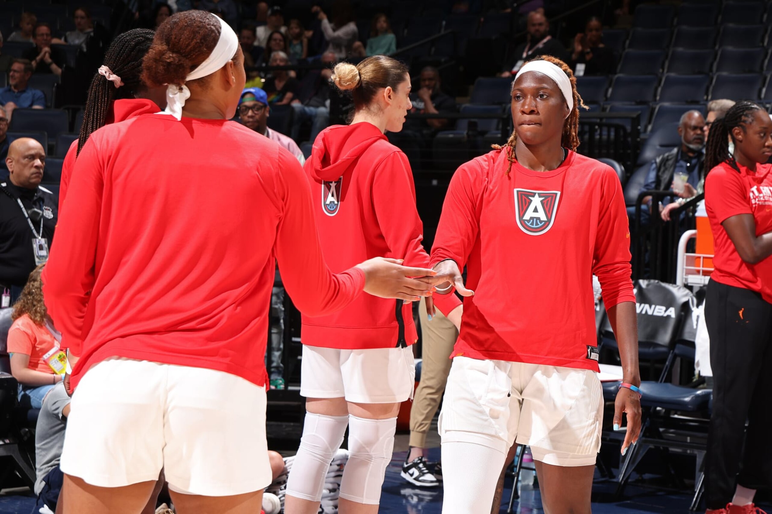 MINNEAPOLIS, MN -  JUNE 19: Rhyne Howard #10 of the Atlanta Dream high fives Naz Hillmon #00 before the game against the Minnesota Lynx on June 19, 2024 at Target Center in Minneapolis, Minnesota. NOTE TO USER: User expressly acknowledges and agrees that, by downloading and or using this Photograph, user is consenting to the terms and conditions of the Getty Images License Agreement. Mandatory Copyright Notice: Copyright 2024 NBAE (Photo by David Sherman/NBAE via Getty Images)