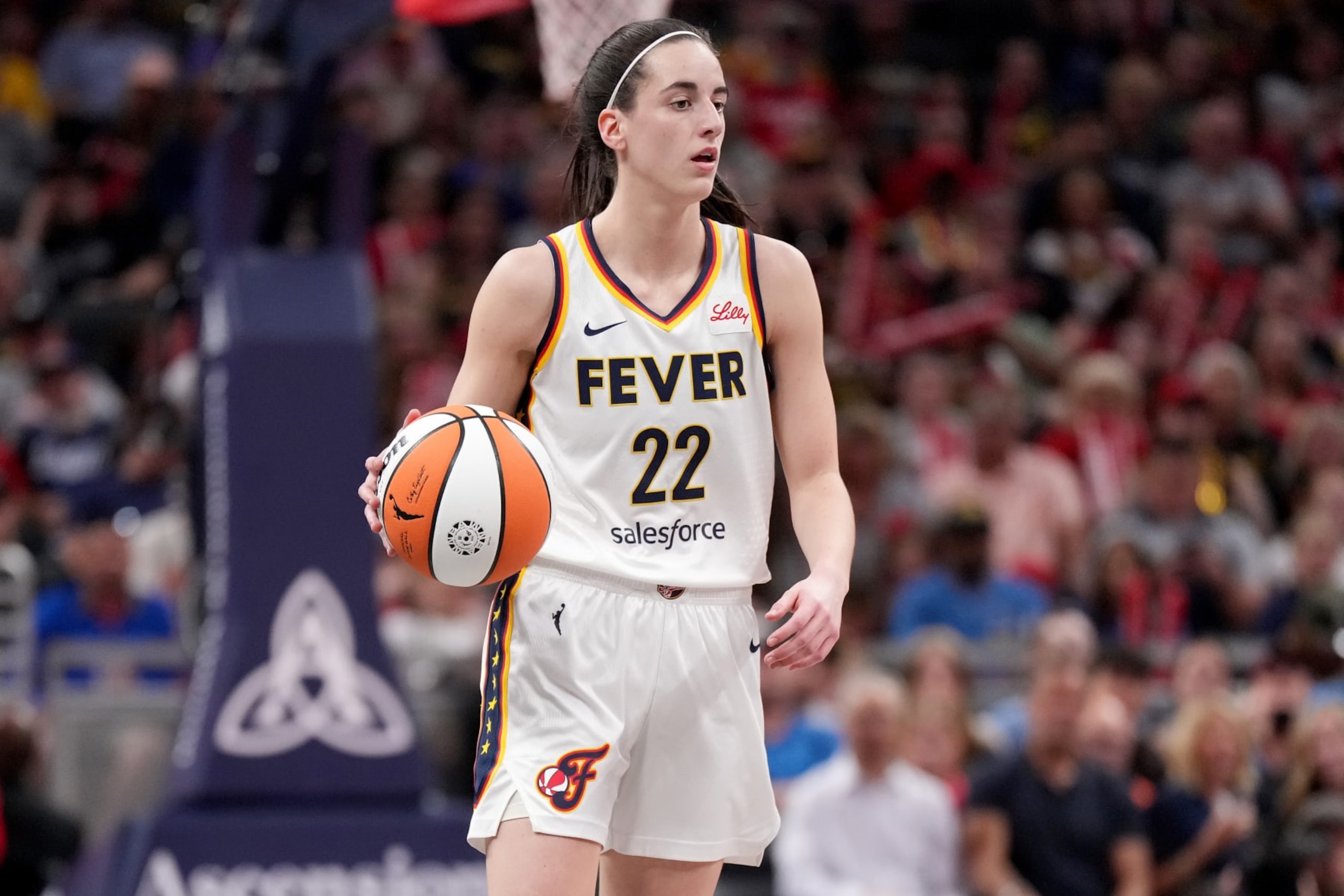 INDIANAPOLIS, INDIANA - JUNE 19: Caitlin Clark #22 of the Indiana Fever dribbles the ball during a game against the Washington Mystics at Gainbridge Fieldhouse on June 19, 2024 in Indianapolis, Indiana. NOTE TO USER: User expressly acknowledges and agrees that, by downloading and or using this photograph, User is consenting to the terms and conditions of the Getty Images License Agreement. (Photo by Emilee Chinn/Getty Images)