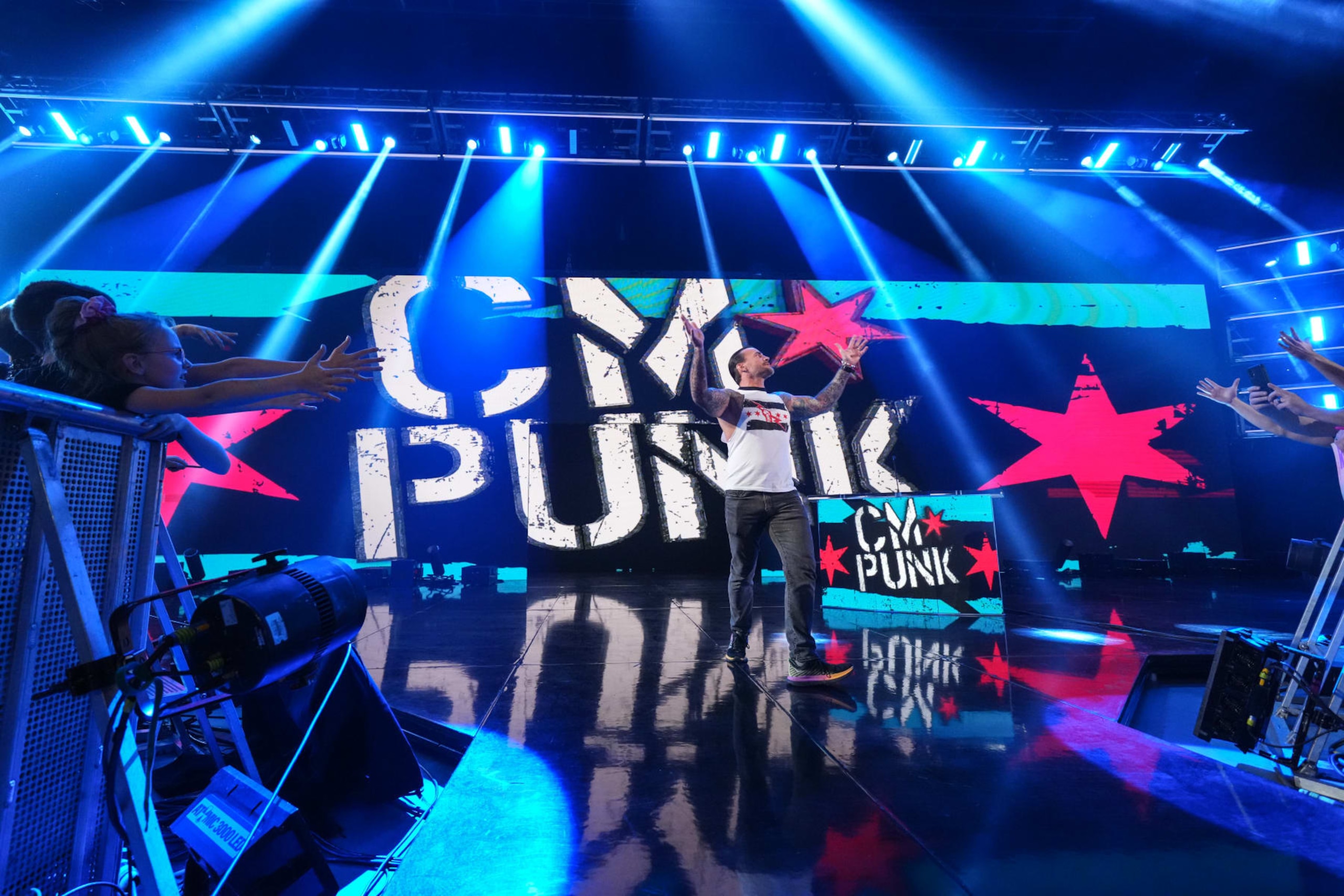 KANSAS CITY, MISSOURI - APRIL 29: CM Punk makes his way to the ring at T-Mobile Center on April 29, 2024 in Kansas City, Missouri.  (Photo by WWE/Getty Images)